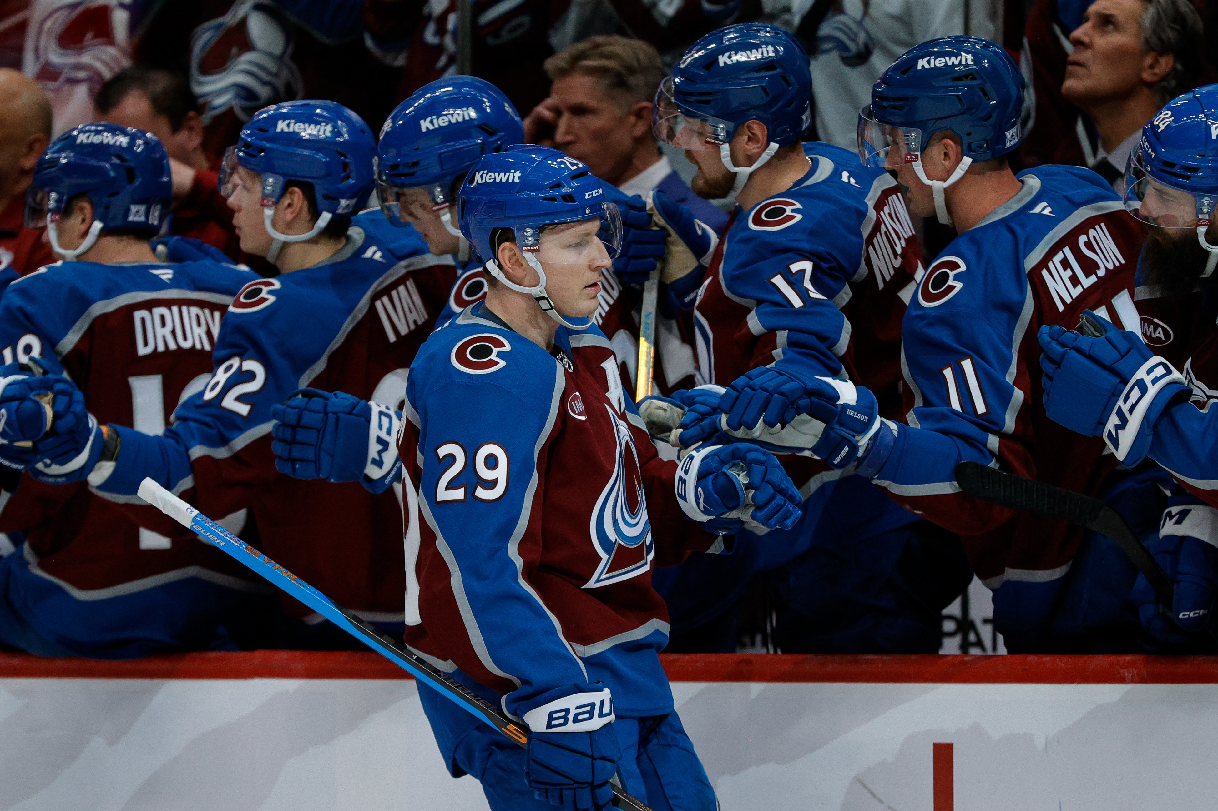 Colorado Avalanche center Nathan MacKinnon (29) celebrates with the bench after his goal as we break down our NHL anytime goal scorer predictions today.