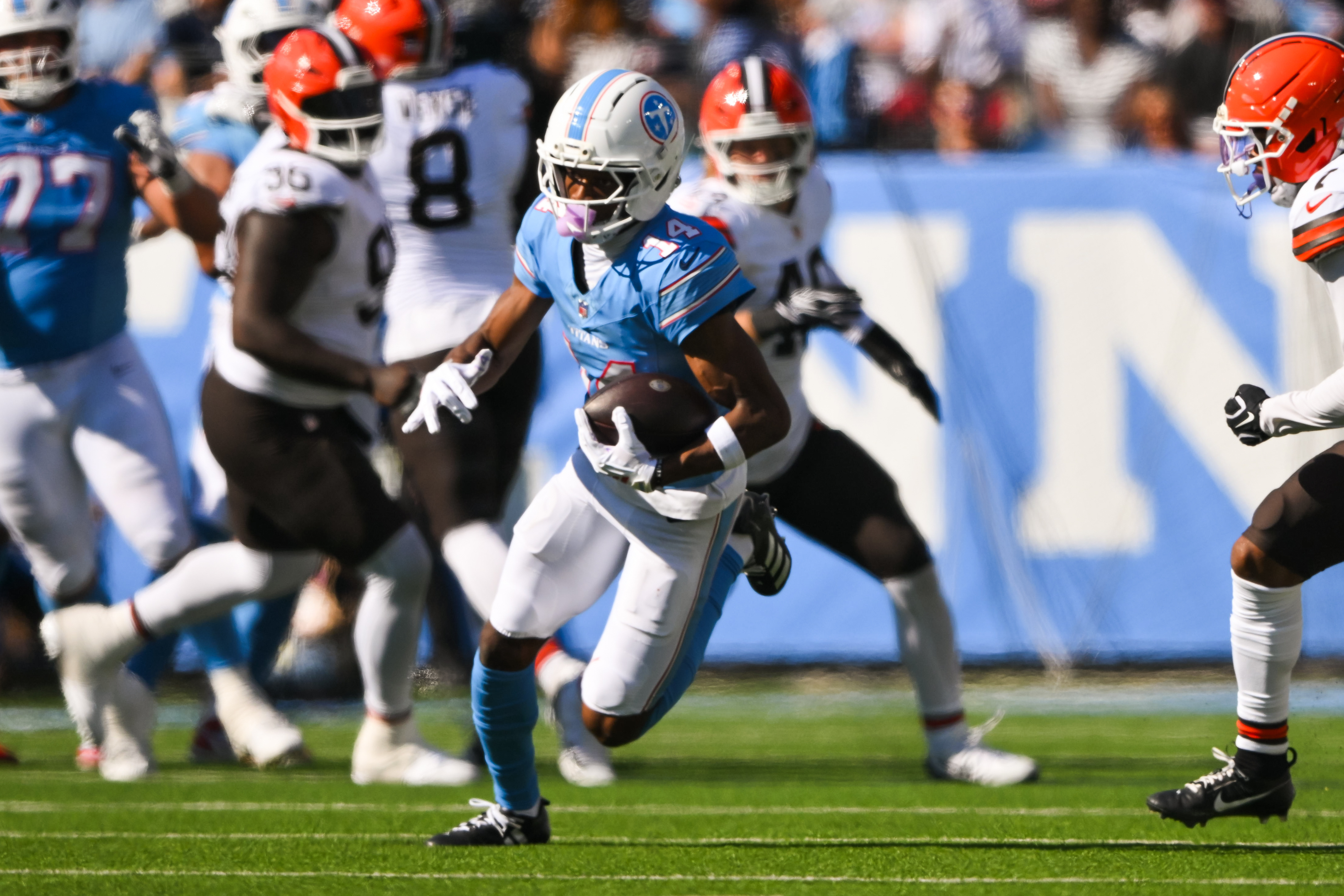 Tennessee Titans wide receiver Carnell Tate (14) runs with the ball after a made catch as we look at the NFL Offensive Rookie of the Year odds. 