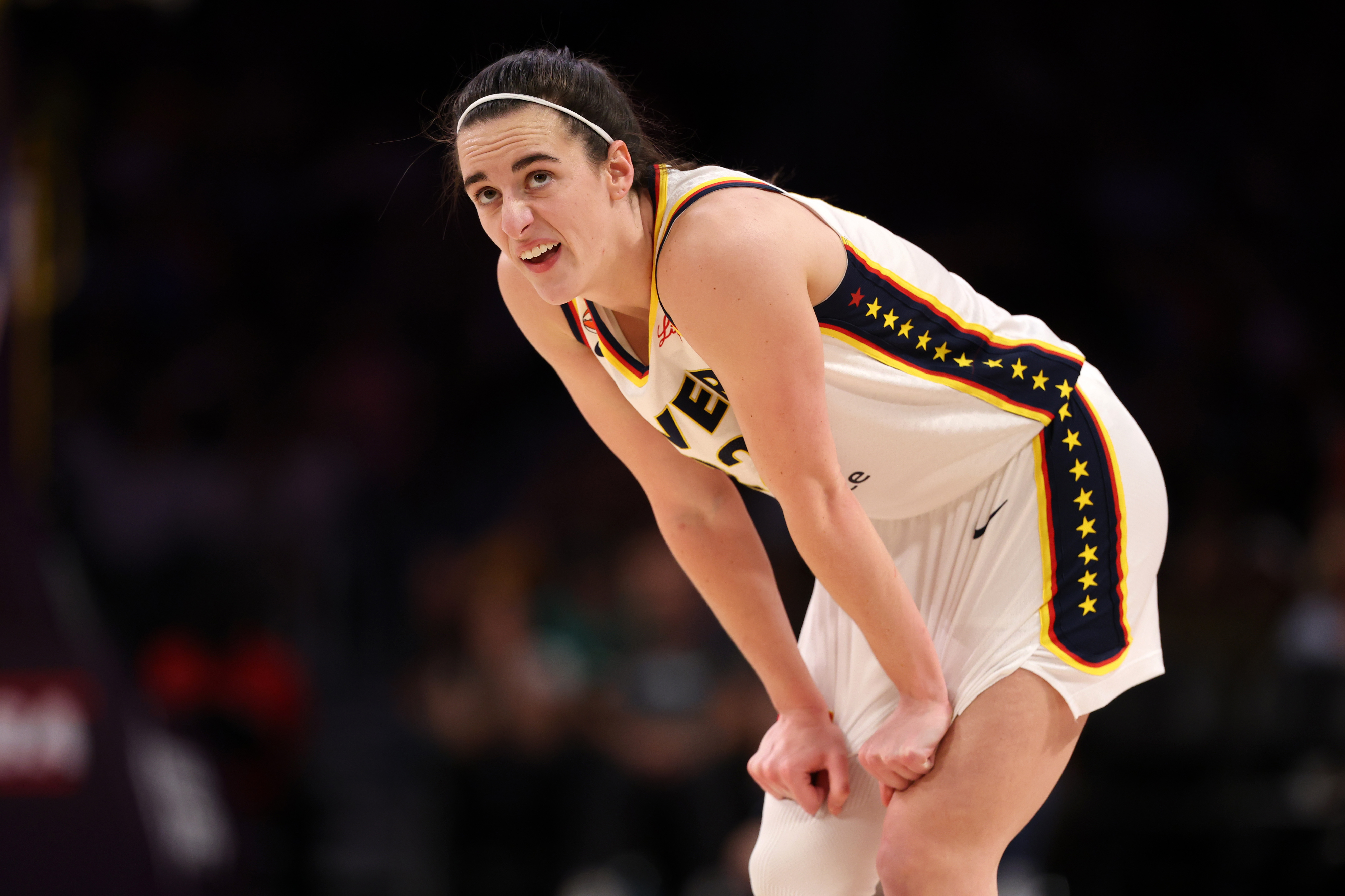 Indiana Fever guard Caitlin Clark (22) reacts to a play as she is featured in our Valkyries vs. Fever prediction.