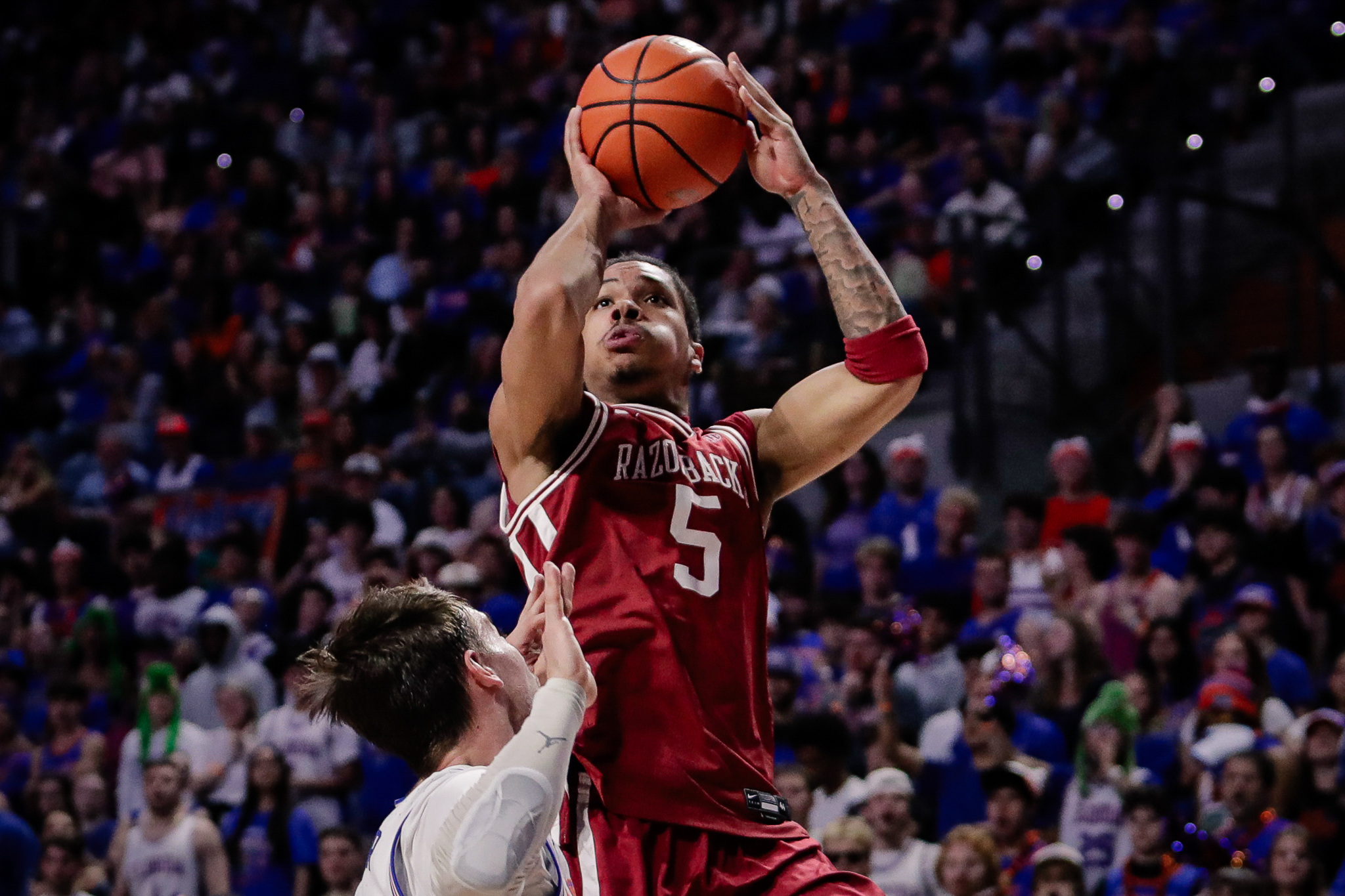 Arkansas Razorbacks guard Darius Acuff Jr. shoots as we offer our college basketball best bets today.