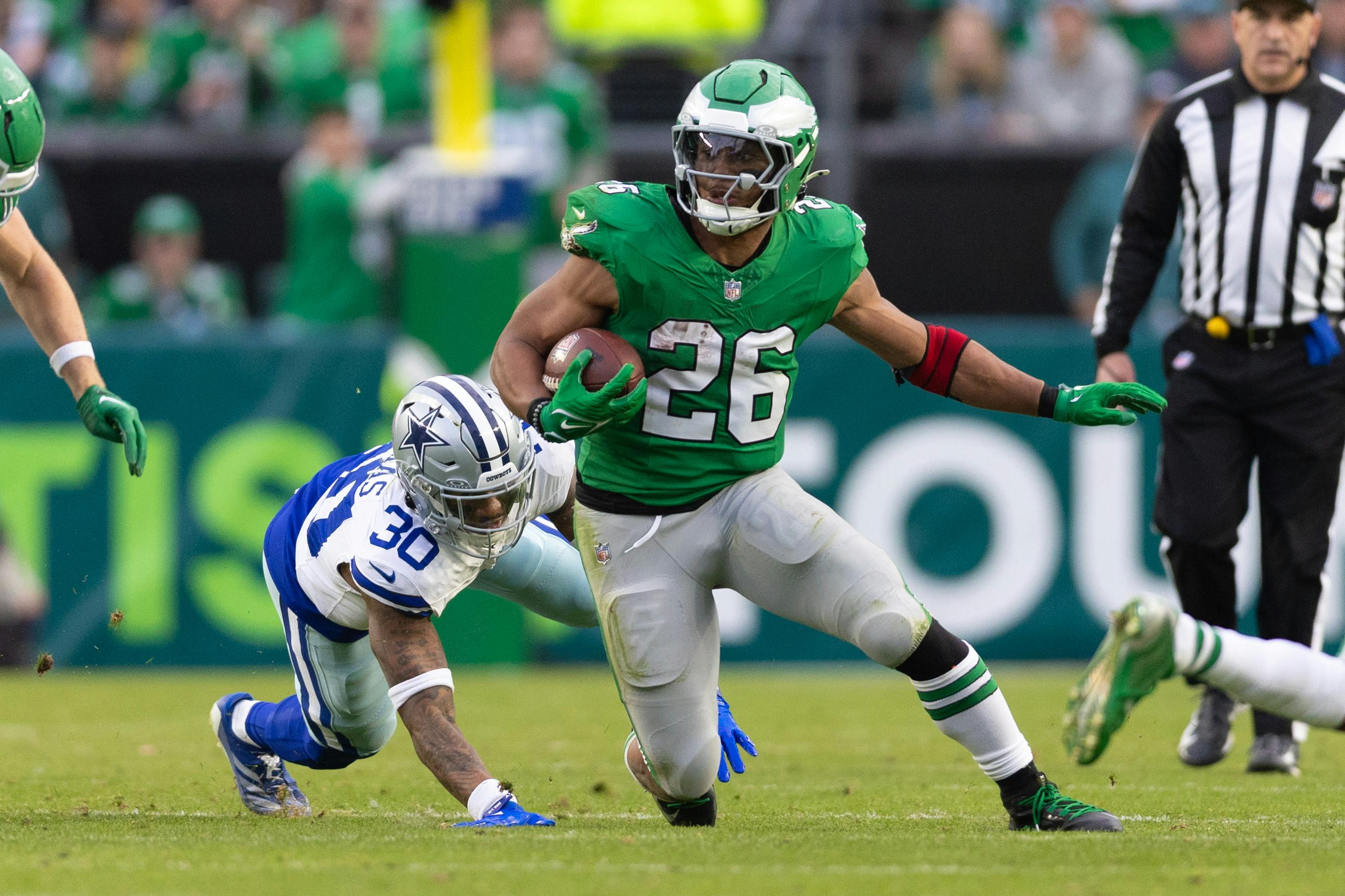 Philadelphia Eagles running back Saquon Barkley runs against the Dallas Cowboys as we break down the NFL Offensive Player of the Year odds. 