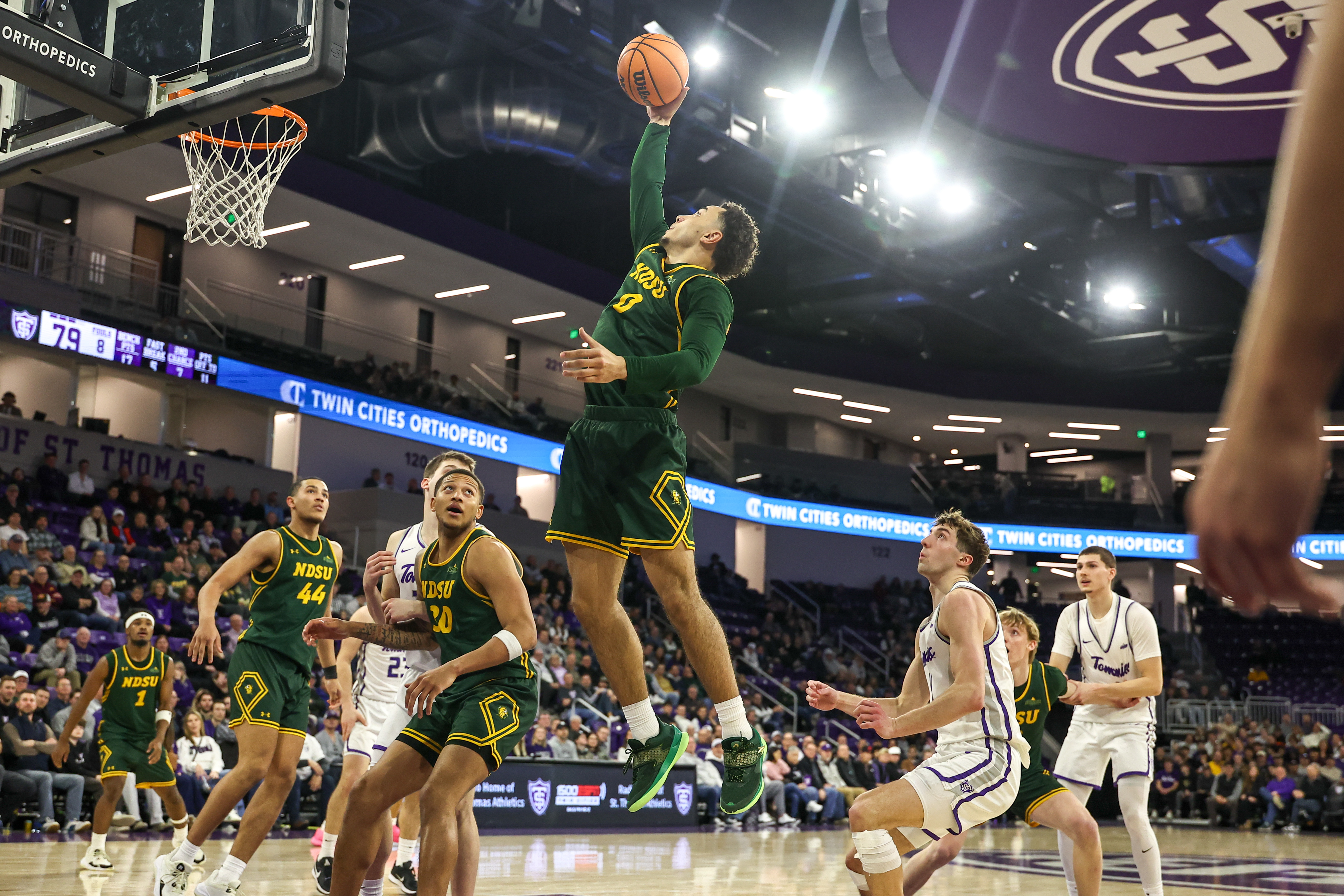 North Dakota State Bison guard Tren Carson (0) grabs a rebound as we break down our North Dakota vs. North Dakota State prediction.