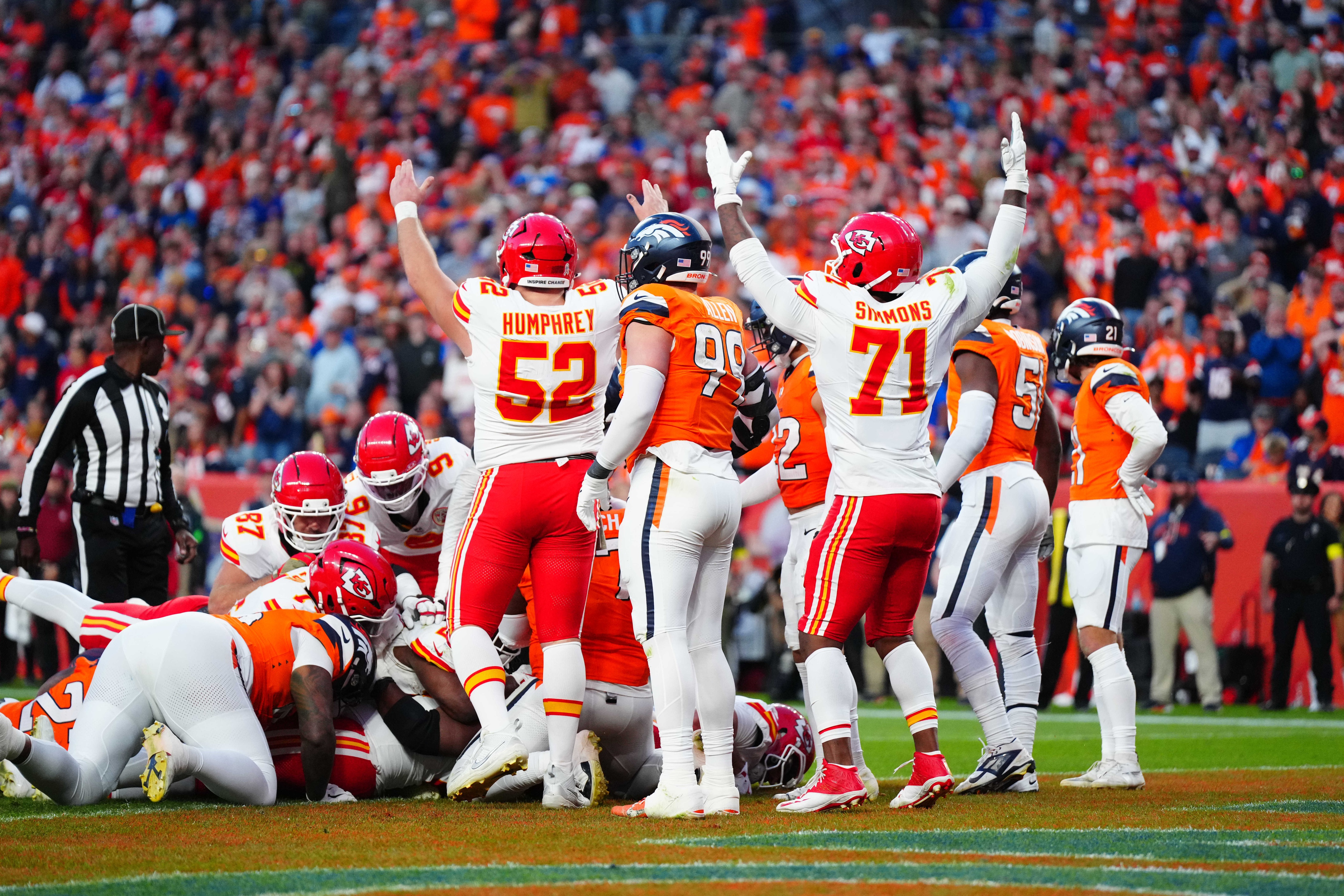 Kansas City Chiefs center Creed Humphrey (52) and offensive tackle Josh Simmons (71) celebrate against the Denver Broncos as we break down our NFL Christmas Day predictions and odds.