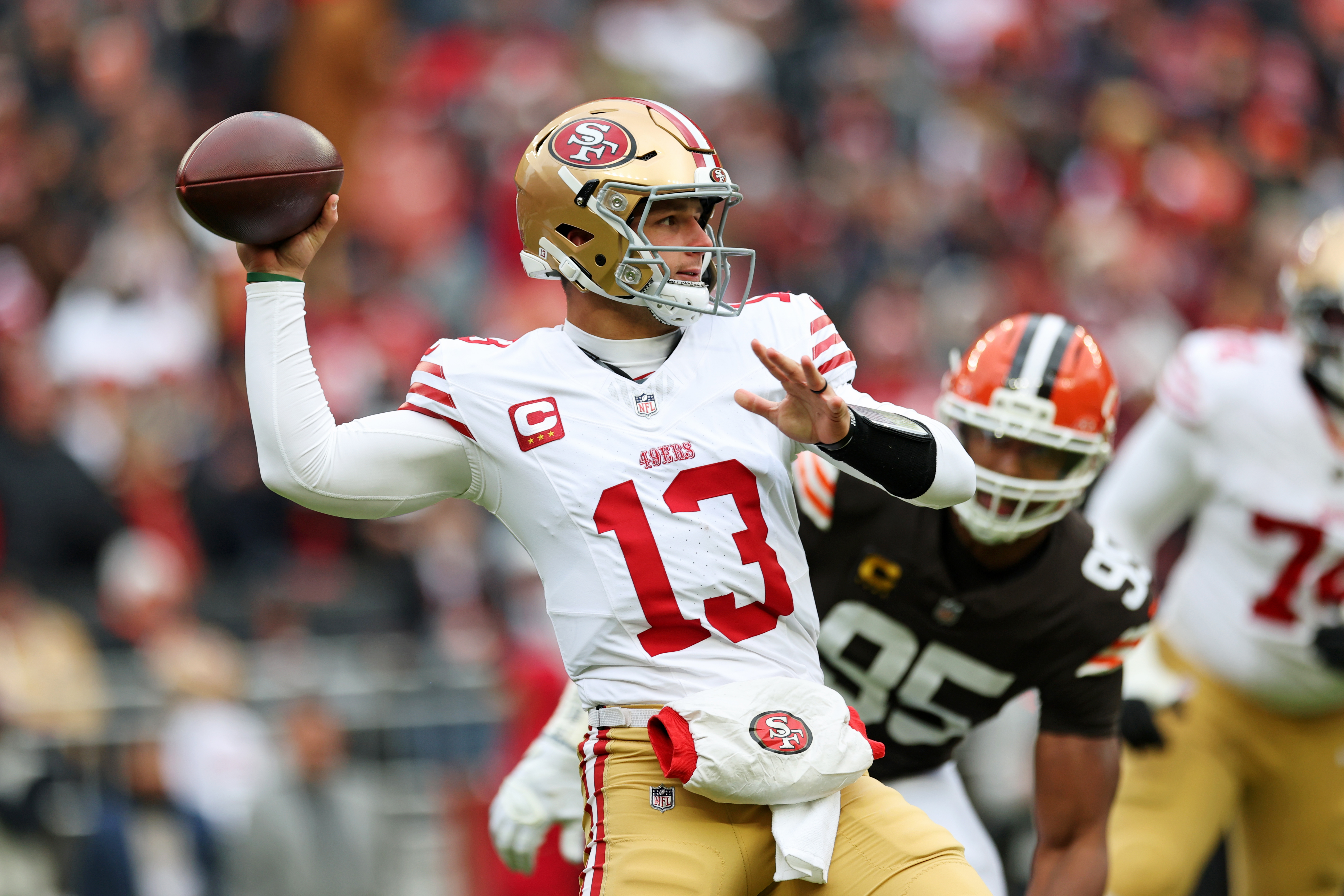 San Francisco 49ers quarterback Brock Purdy (13) looks to pass as we offer our 49ers vs. Colts predictions.