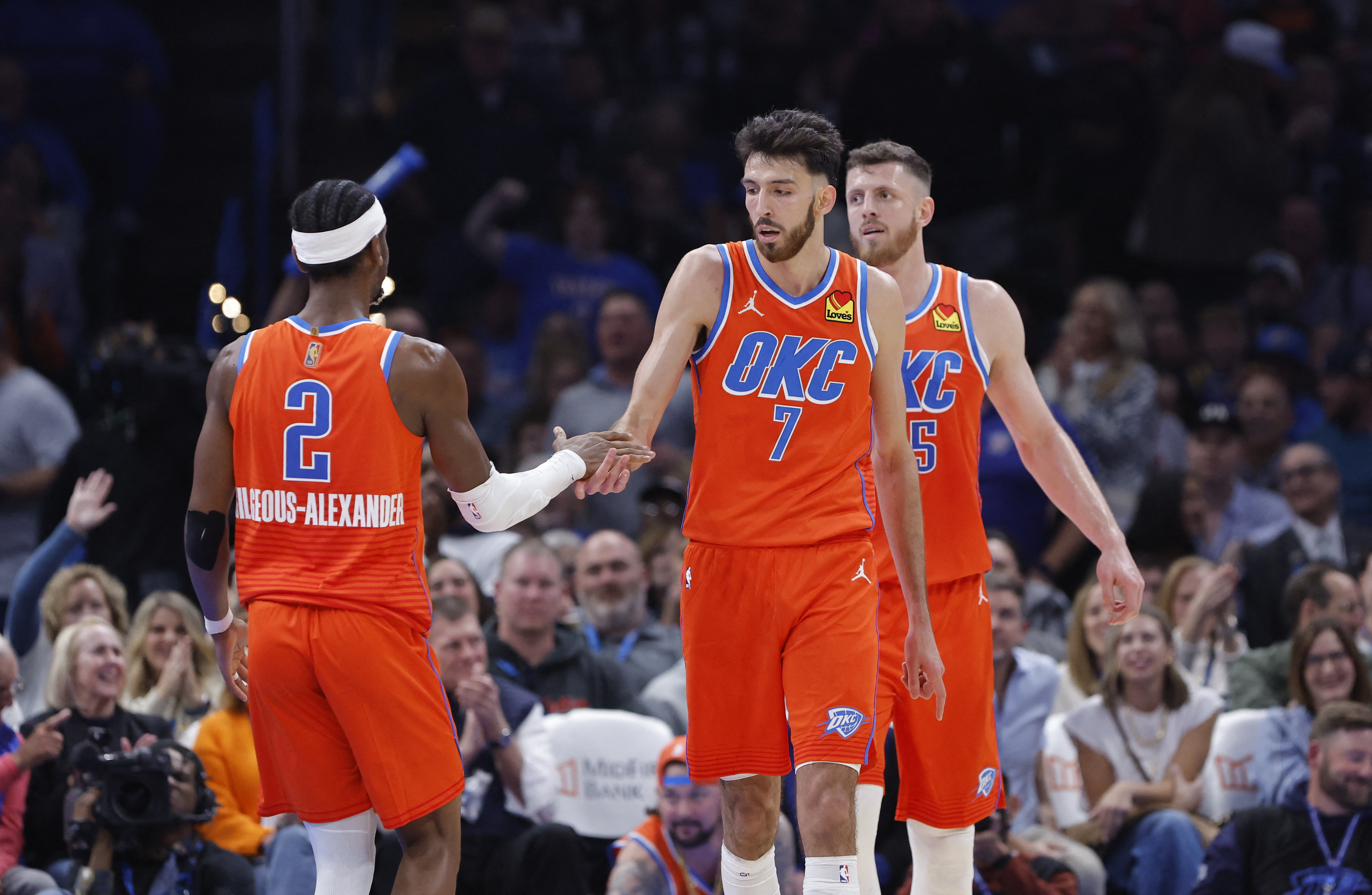 Oklahoma City Thunder center Chet Holmgren (7) and guard Shai Gilgeous-Alexander (2) celebrate as we break down the latest NBA championship odds.