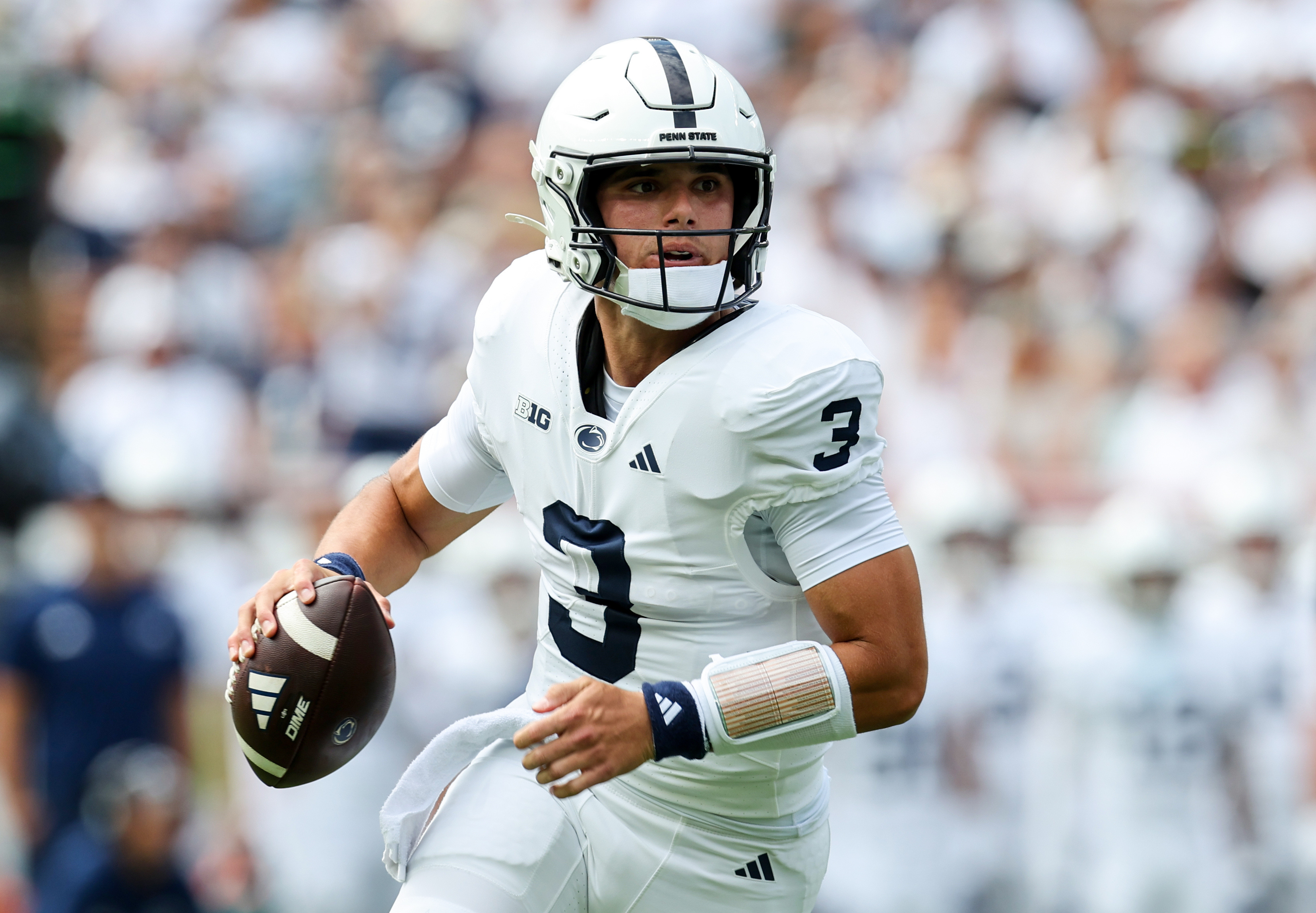 Penn State quarterback Rocco Becht (3) runs with the ball as we break down our Buffalo vs. Penn State prediction.