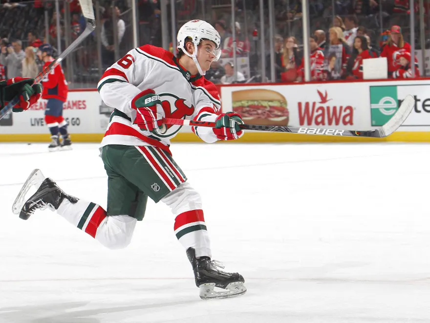 Jack Hughes of the New Jersey Devils shoots during warmups before a game against the Washington Capitals.