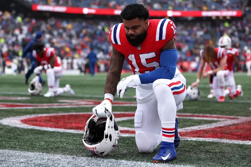 Ezekiel Elliott of the New England Patriots kneels before the game against the Los Angeles Chargers, and we offer new U.S. bettors our exclusive BetRivers bonus code for Patriots vs. Broncos.