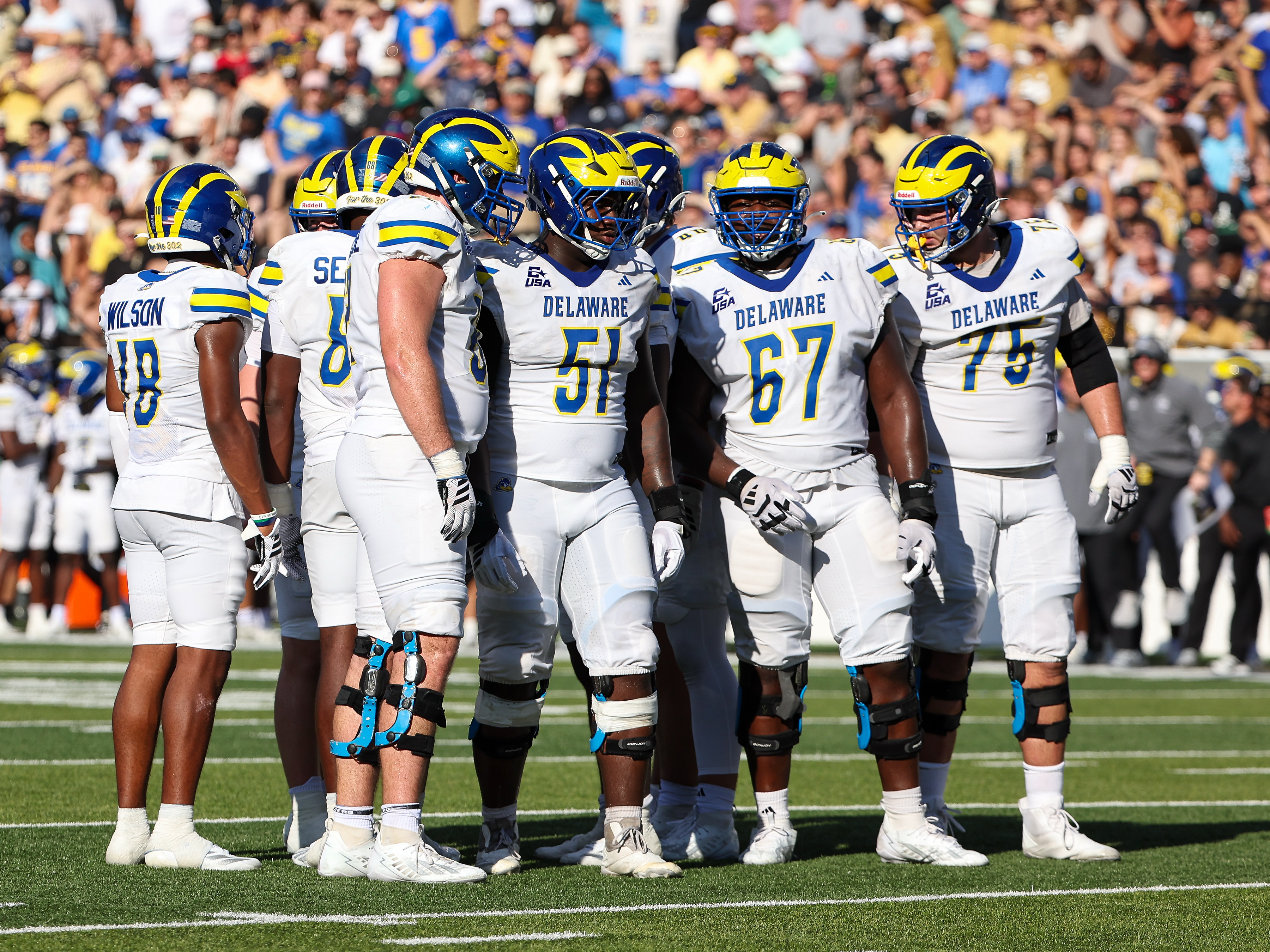 Delaware Fightin' Blue Hens offensive lineman Chandler Telfaire (51) leads the Delaware offensive line as we make our best Liberty vs. Delaware prediction.