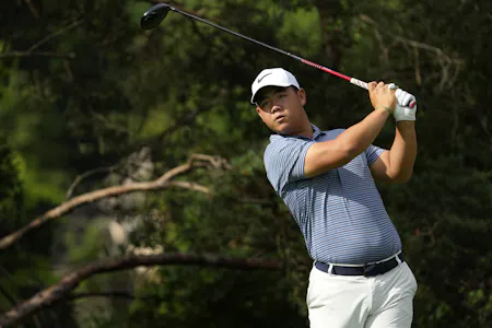 Tom Kim plays his shot from the tee as we look at our top U.S. Open picks and predictions