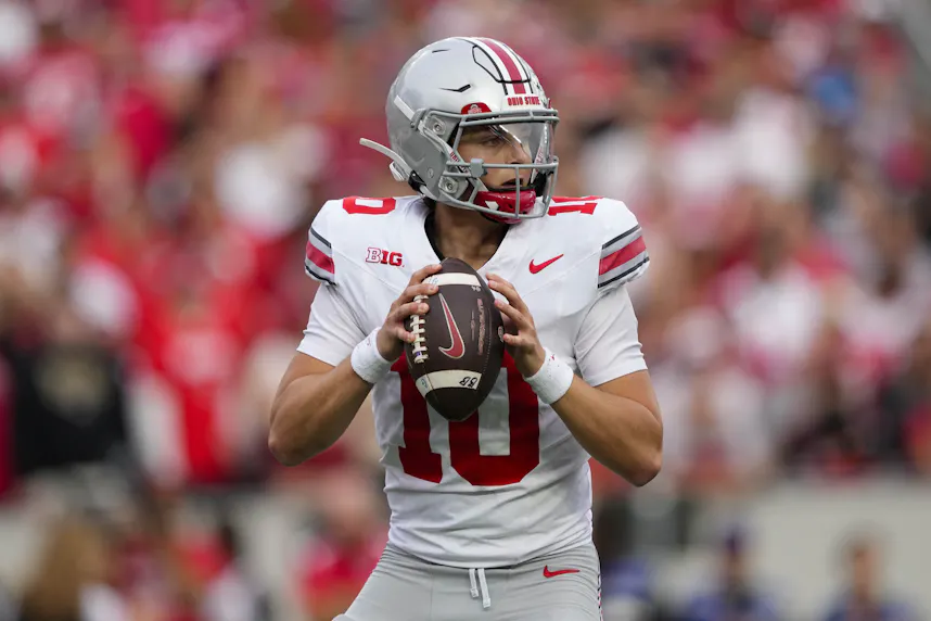 Ohio State quarterback Julian Sayin throws a pass against Wisconsin. Sayin is key to our Penn State vs. Ohio State prediction.