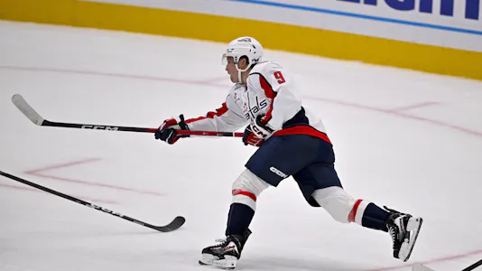 Washington Capitals right wing Ryan Leonard (9) shoots the puck as we make our best Islanders vs. Washington player prop predictions.