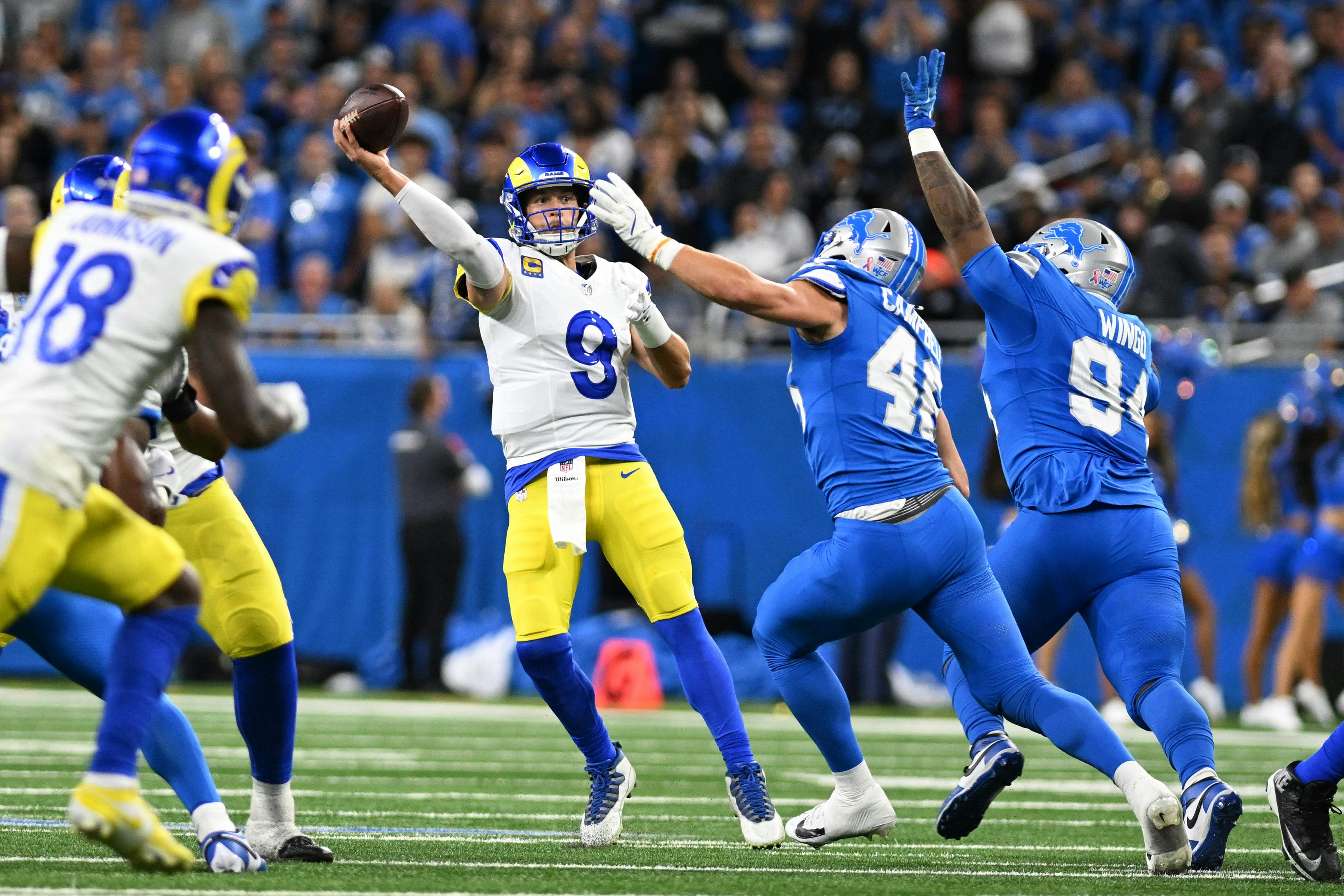 Los Angeles Rams quarterback Matthew Stafford throws a pass as we offer our NFL playoff bracket predictions with picks and projected scores for every game.