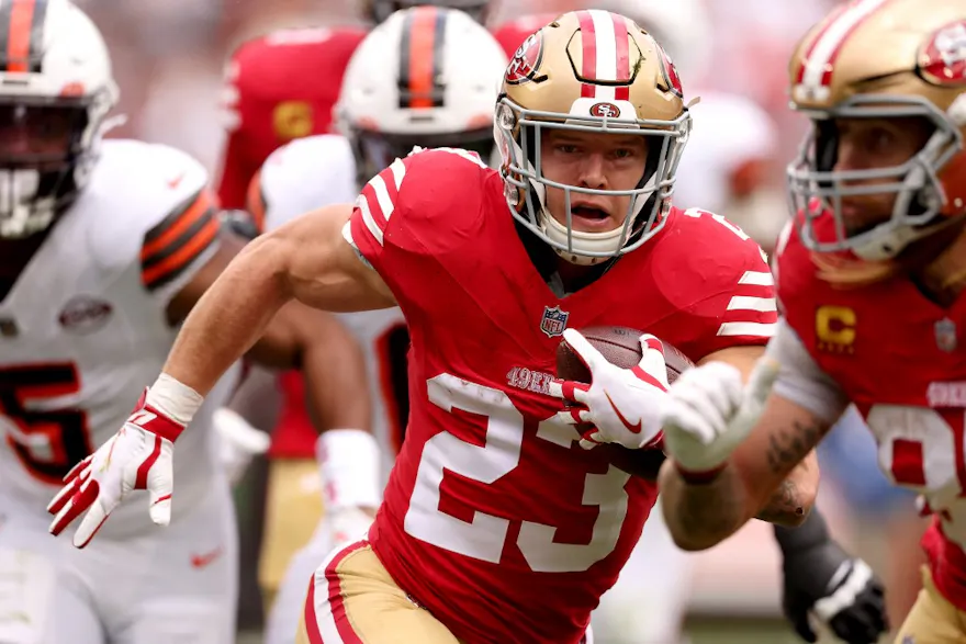 Christian McCaffrey of the San Francisco 49ers runs for a touchdown after a catch during the first quarter against the Cleveland Browns as we look at our Caesars promo code for the NFL's Thanksgiving games.
