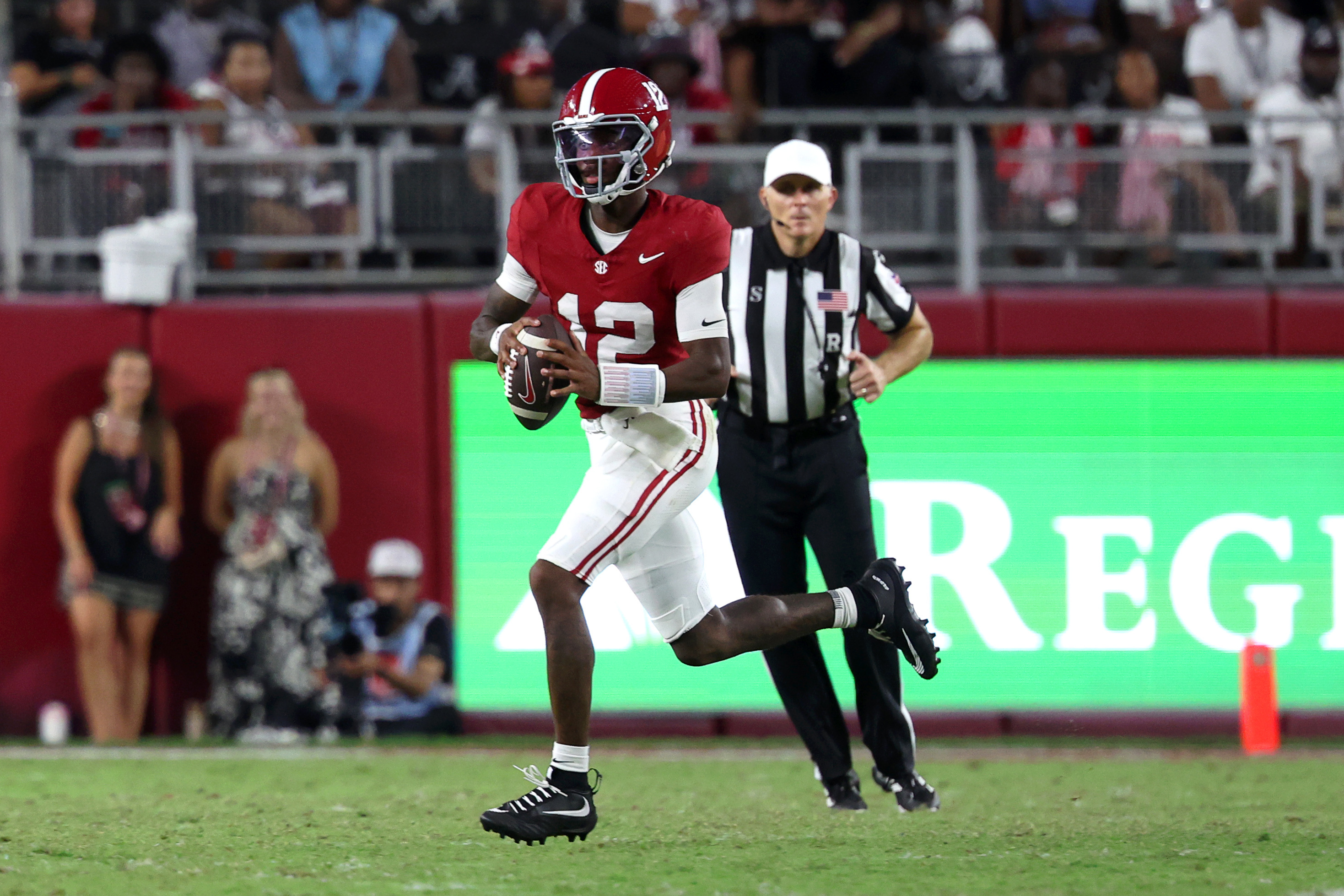 Alabama Crimson Tide quarterback Keelon Russell (12) carries the ball as he is featured in our South Carolina vs. Alabama prediction.