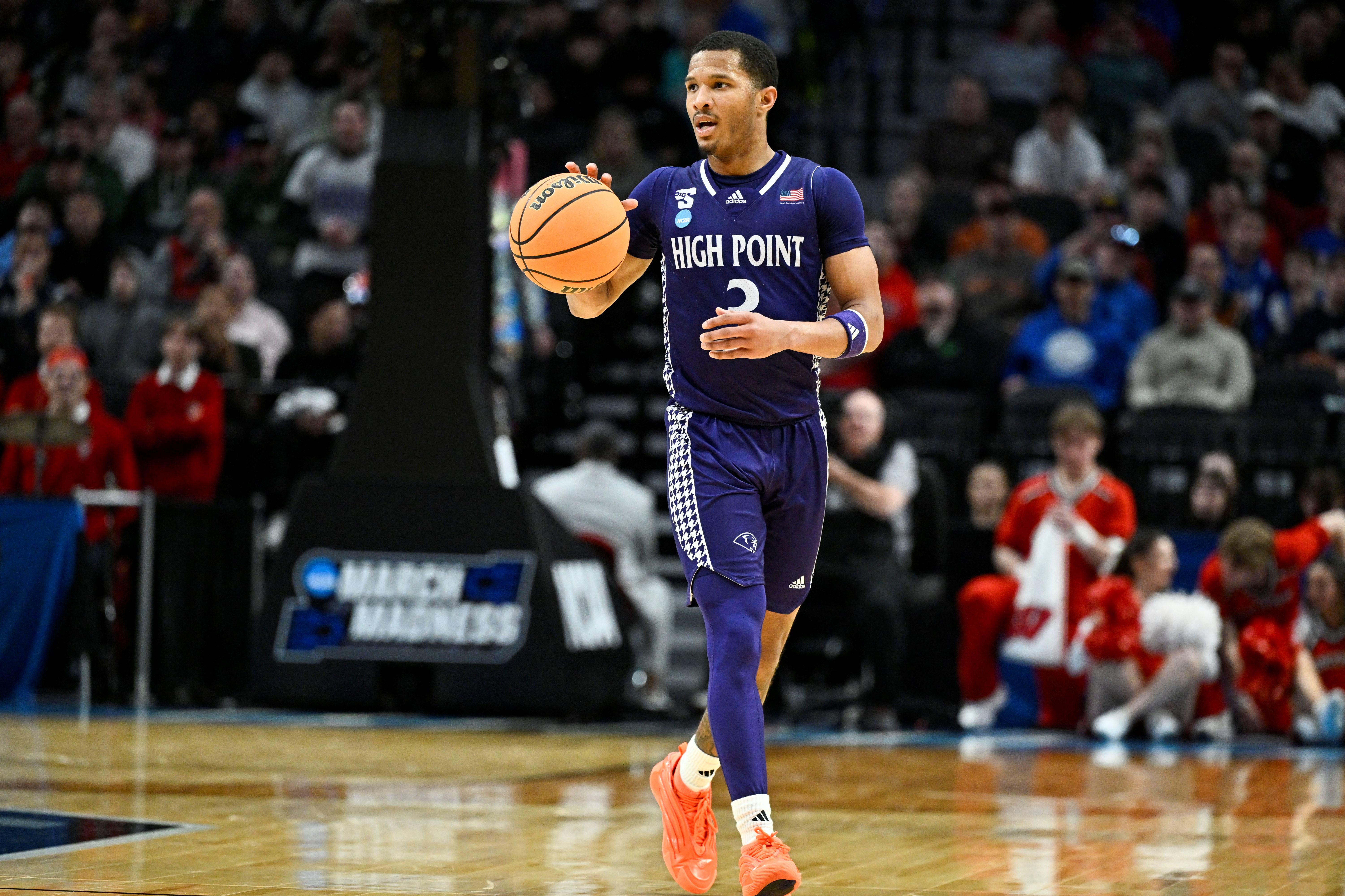 High Point Panthers guard Rob Martin brings the ball up the court as we make our best High Points vs. Arkansas prediction.
