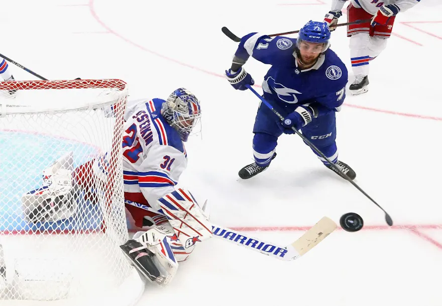 Igor Shesterkin #31 of the New York Rangers deflects a shot away from Anthony Cirelli #71 of the Tampa Bay Lightning in Game Four of the Eastern Conference Final of the 2022 Stanley Cup Playoffs at Amalie Arena on June 7.