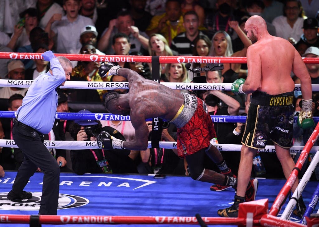 Deontay Wilder goes down as WBC heavyweight champion Tyson Fury knocks him out in the 11th round at T-Mobile Arena in Las Vegas on Oct. 9, 2021, and Sportsbook Review spoke to Wilder about that loss.