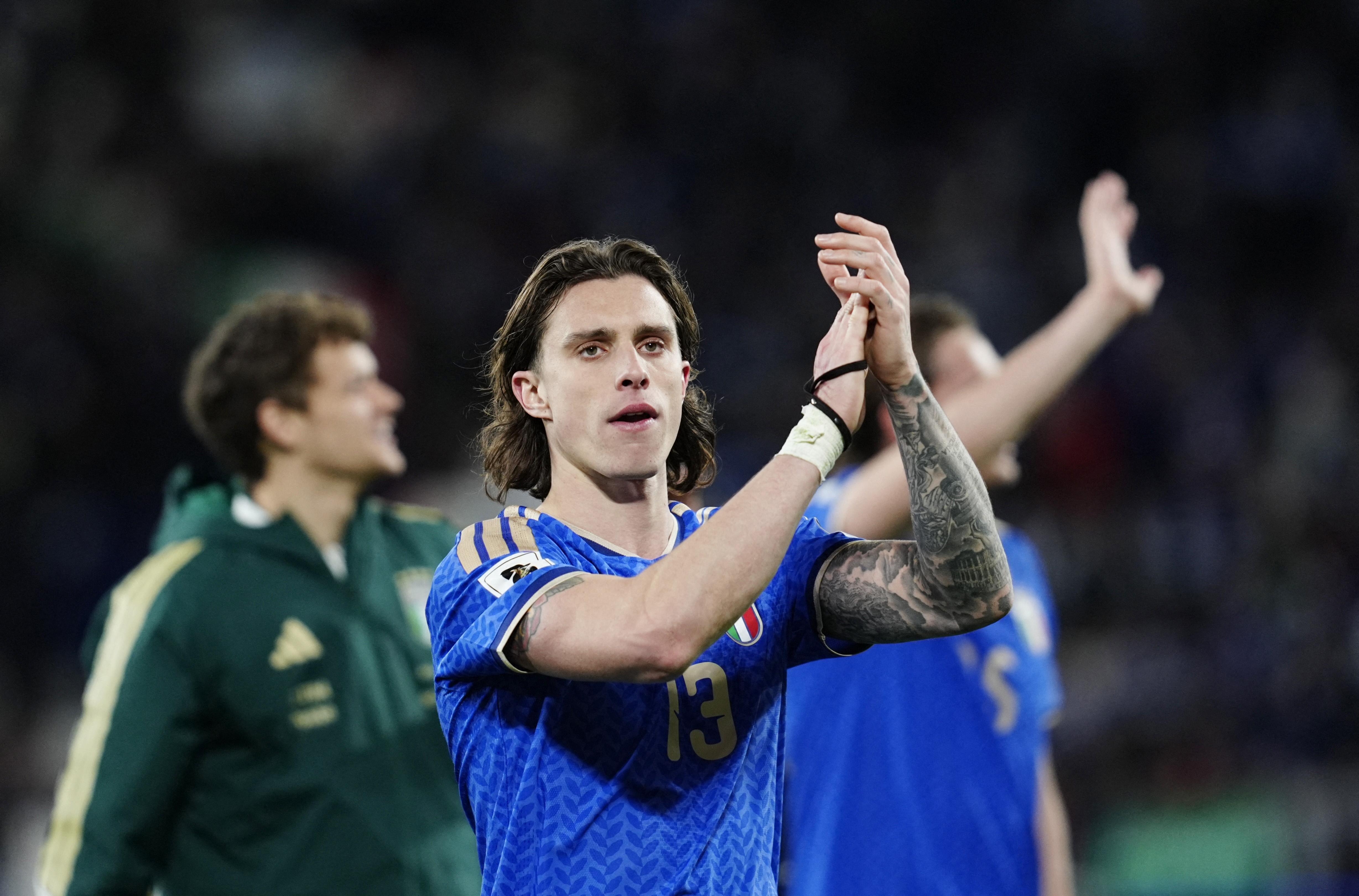 Italy's Riccardo Calafiori applauds fans as we make our best Italy vs. Belgium prediction