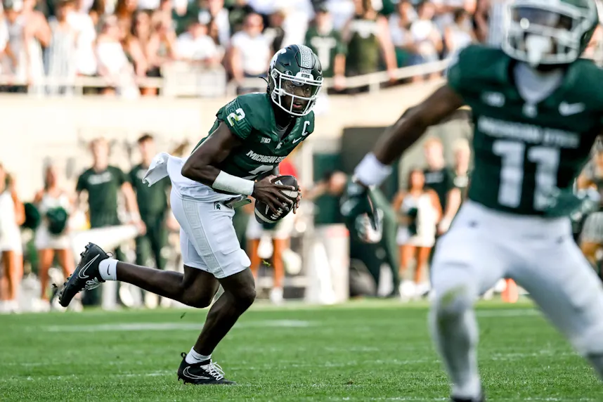 Michigan State's Aidan Chiles looks to throw against Prairie View A&M. We're backing MSU in our Big Ten predictions.