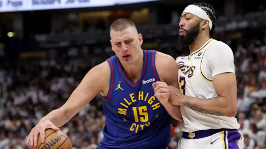  Nikola Jokic #15 of the Denver Nuggets drives against Anthony Davis #3 of the Los Angeles Lakers as we look at our best Lakers vs. Nuggets Game 2 NBA player props