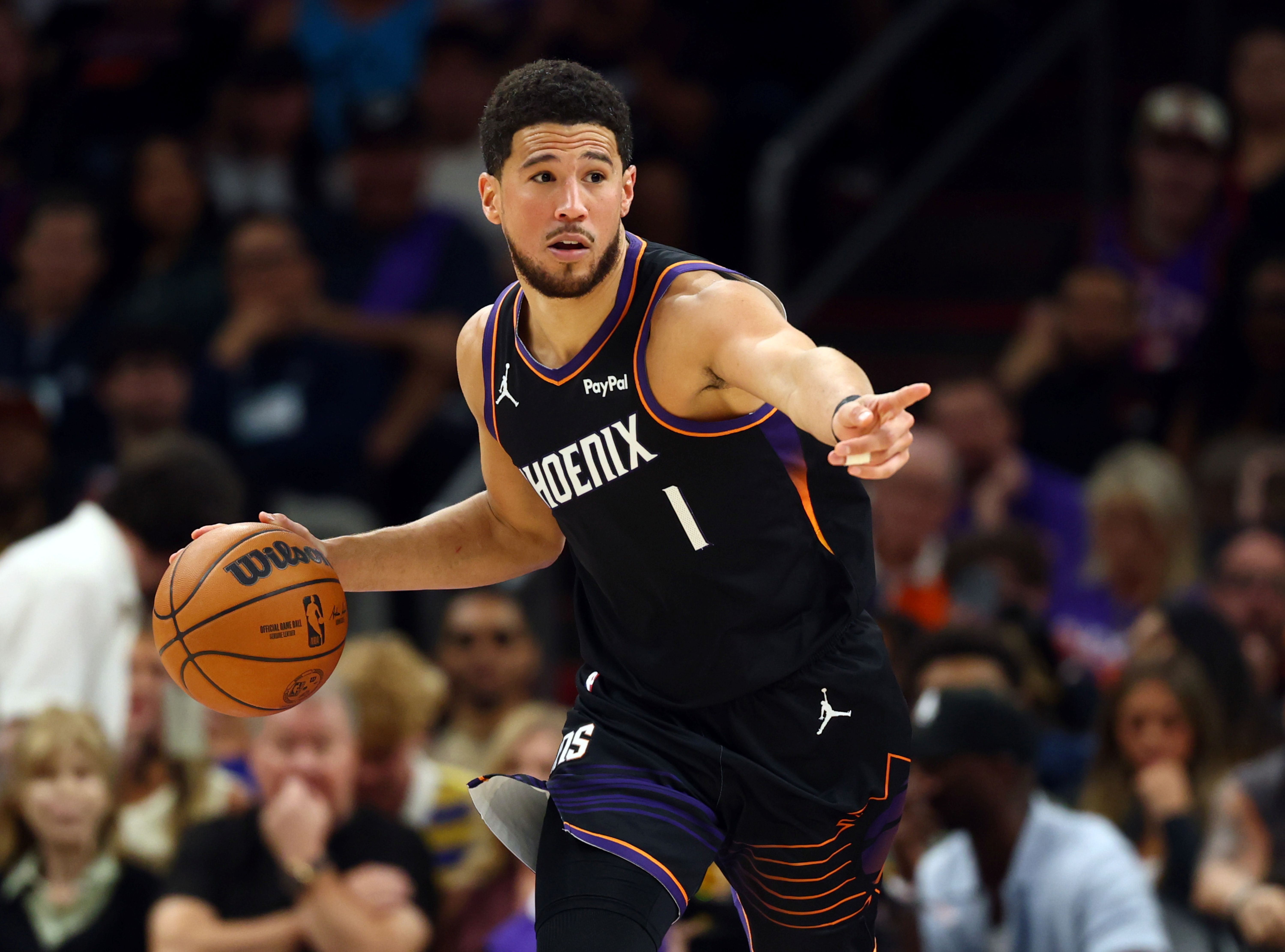 Phoenix Suns guard Devin Booker dribbles, and he's key as we look at the our NBA player props today.