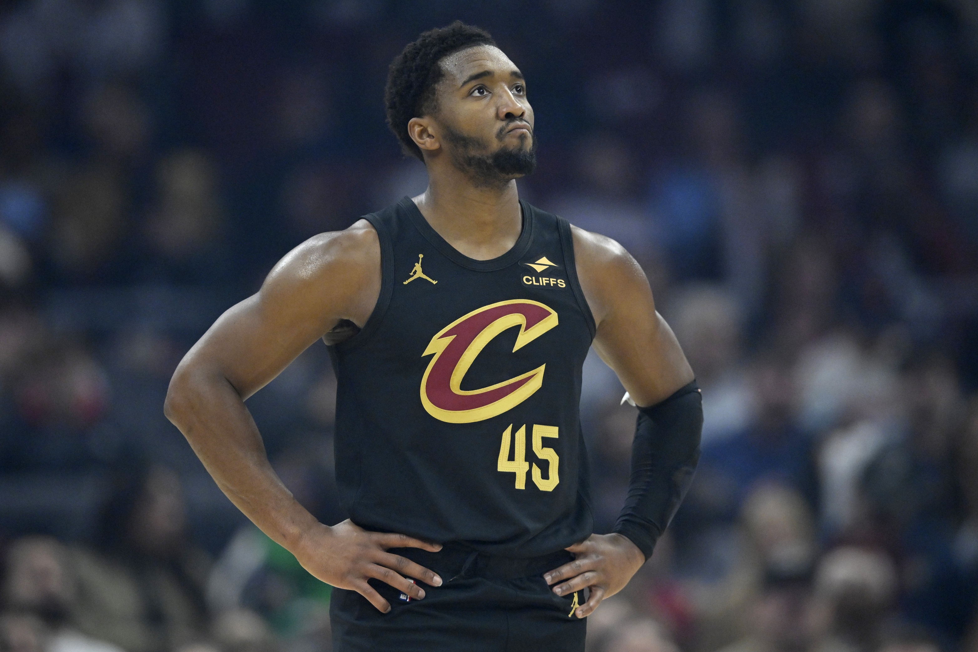 Cleveland Cavaliers guard Donovan Mitchell stands on the court as we make our best Cavaliers vs. Bulls player prop predictions.
