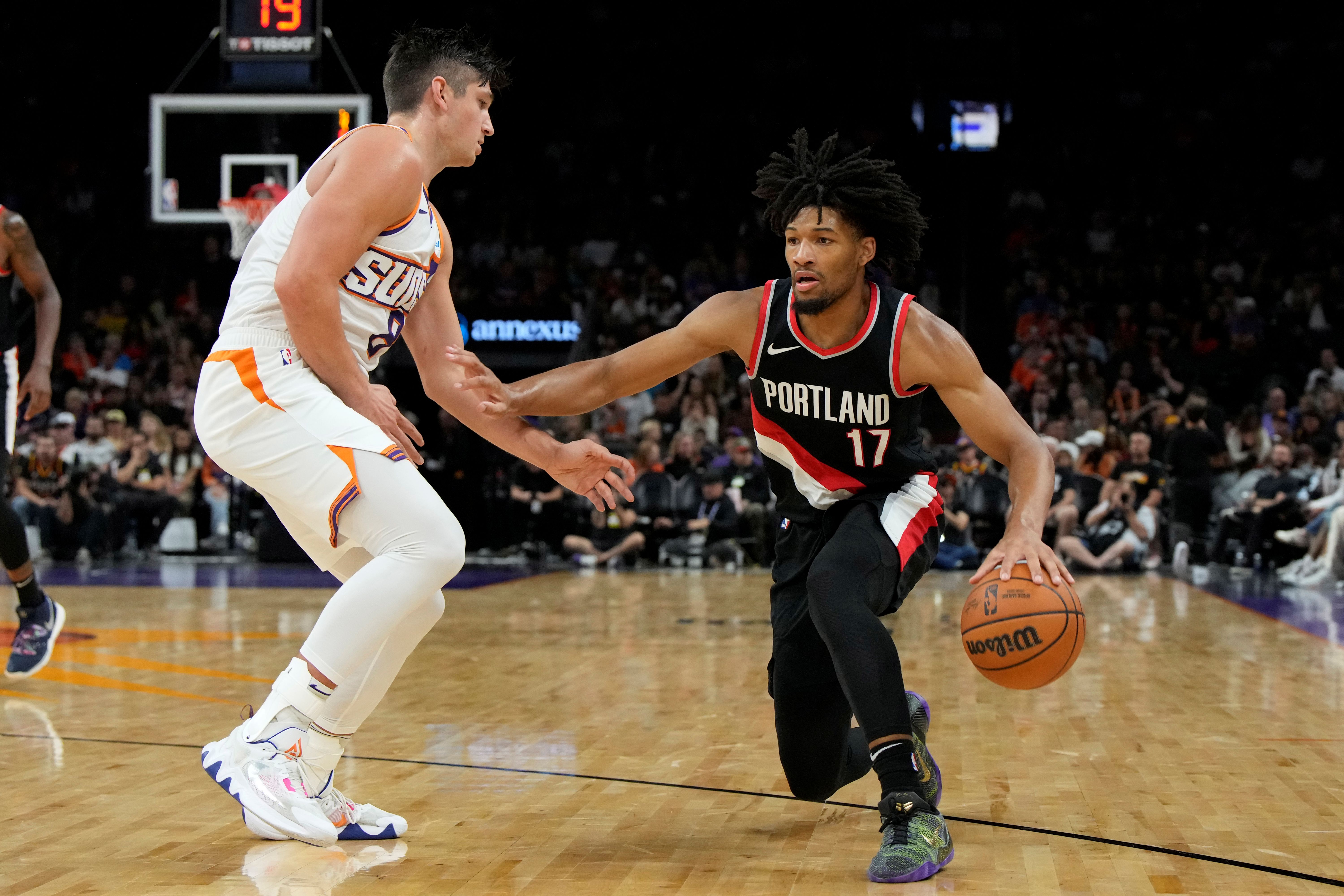 Portland Trail Blazers guard Shaedon Sharpe (17) drives on Phoenix Suns guard Grayson Allen (8), and both are featured in our Suns vs. Trail Blazers player props.