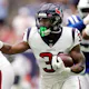 Running Back Dameon Pierce of the Houston Texans carries the ball during the first half against the Indianapolis Colts at NRG Stadium on September 11, 2022 in Houston, Texas. Photo by Carmen Mandato/Getty Images via AFP.