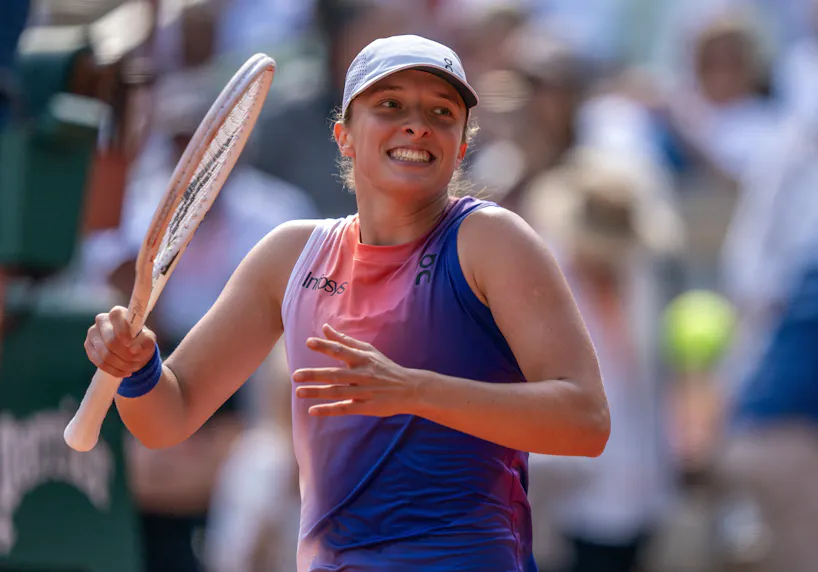 Iga Swiatek of Poland celebrates winning her match as we look at our Swiatek vs. Paolini prediction