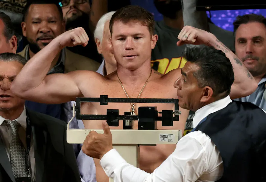 Mexican boxer Saul "Canelo" Alvarez gestures during the weighing ceremony prior to his fight against British boxer John Ryder as we look at our Alvarez-Charlo prediction.