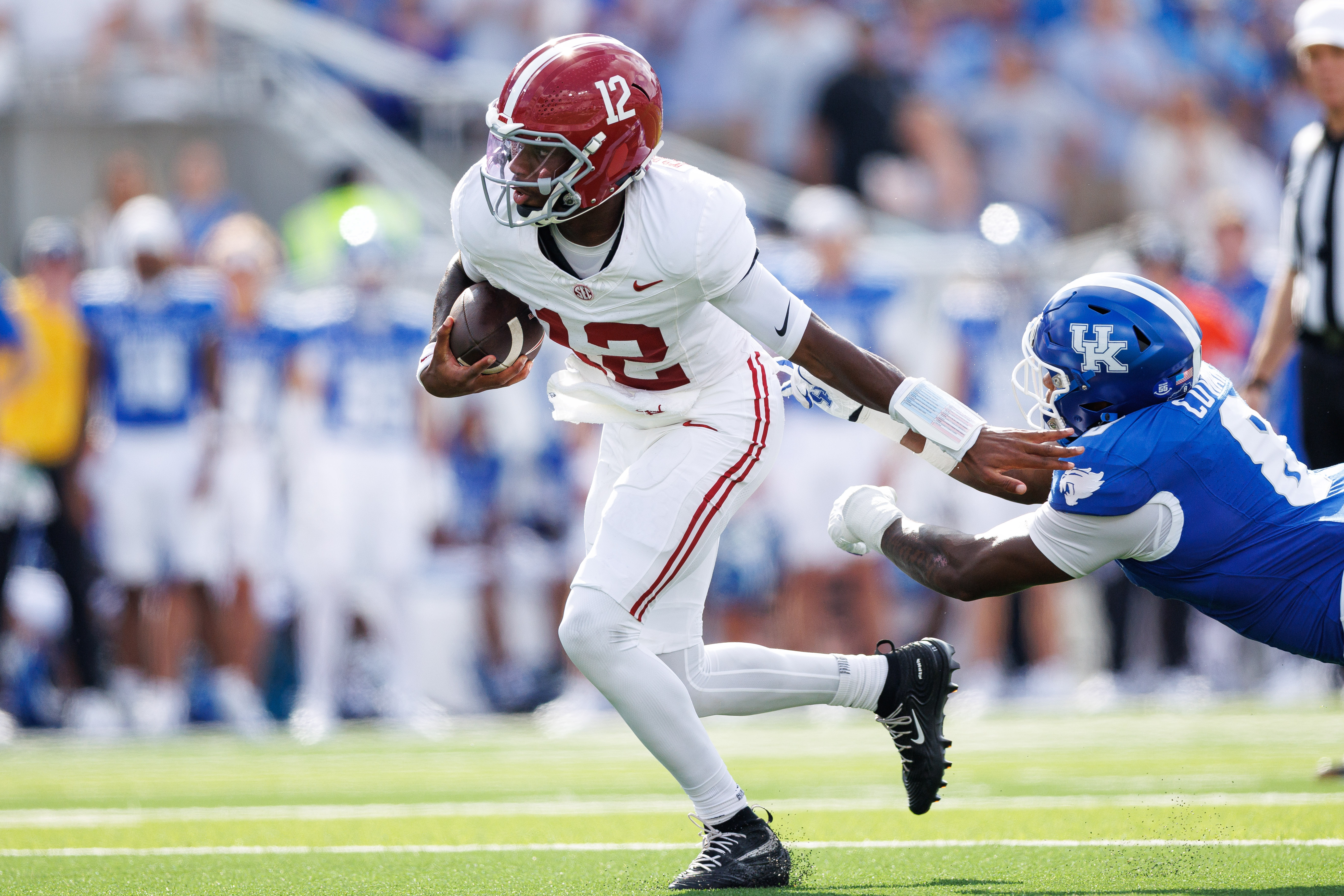 Alabama Crimson Tide quarterback Keelon Russell (12) runs the ball as he is featured in our Florida State vs. Alabama same-game parlay.