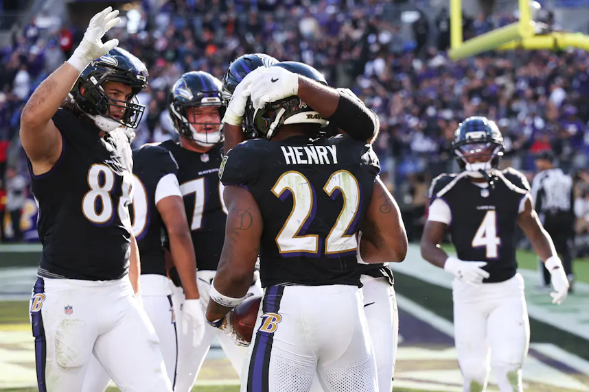 Baltimore Ravens running back Derrick Henry (22) celebrates with teammates as we offer our NFL predictions for Week 9.