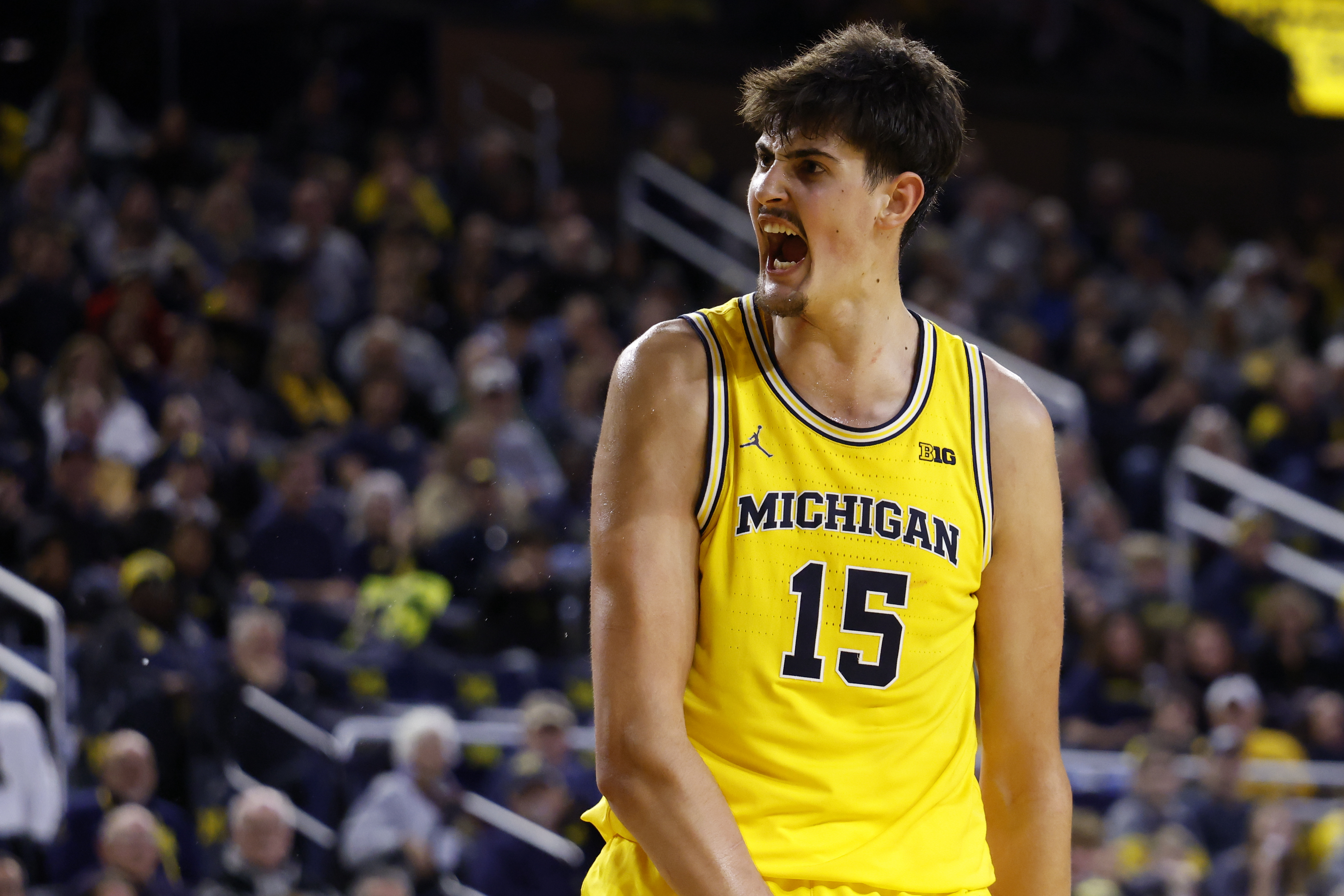 Michigan center Aday Mara (15) reacts as we offer our USC vs. Michigan predictions.