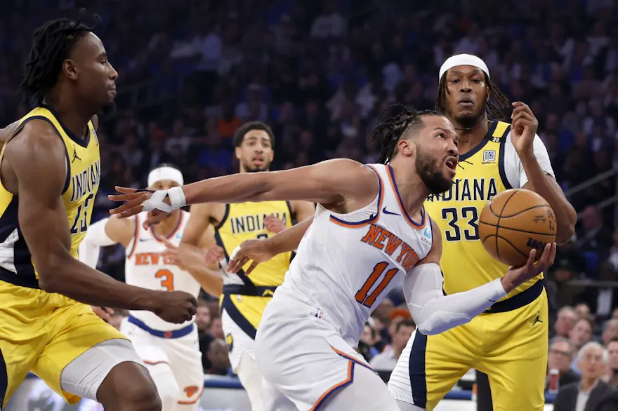 Jalen Brunson of the New York Knicks drives past Aaron Nesmith and Myles Turner of the Indiana Pacers during Game 1 of the playoffs. We're looking at Jalen Brunson Player Props ahead of Game 2. 