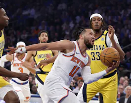 Jalen Brunson of the New York Knicks drives past Aaron Nesmith and Myles Turner of the Indiana Pacers during Game 1 of the playoffs. We're looking at Jalen Brunson Player Props ahead of Game 2. 