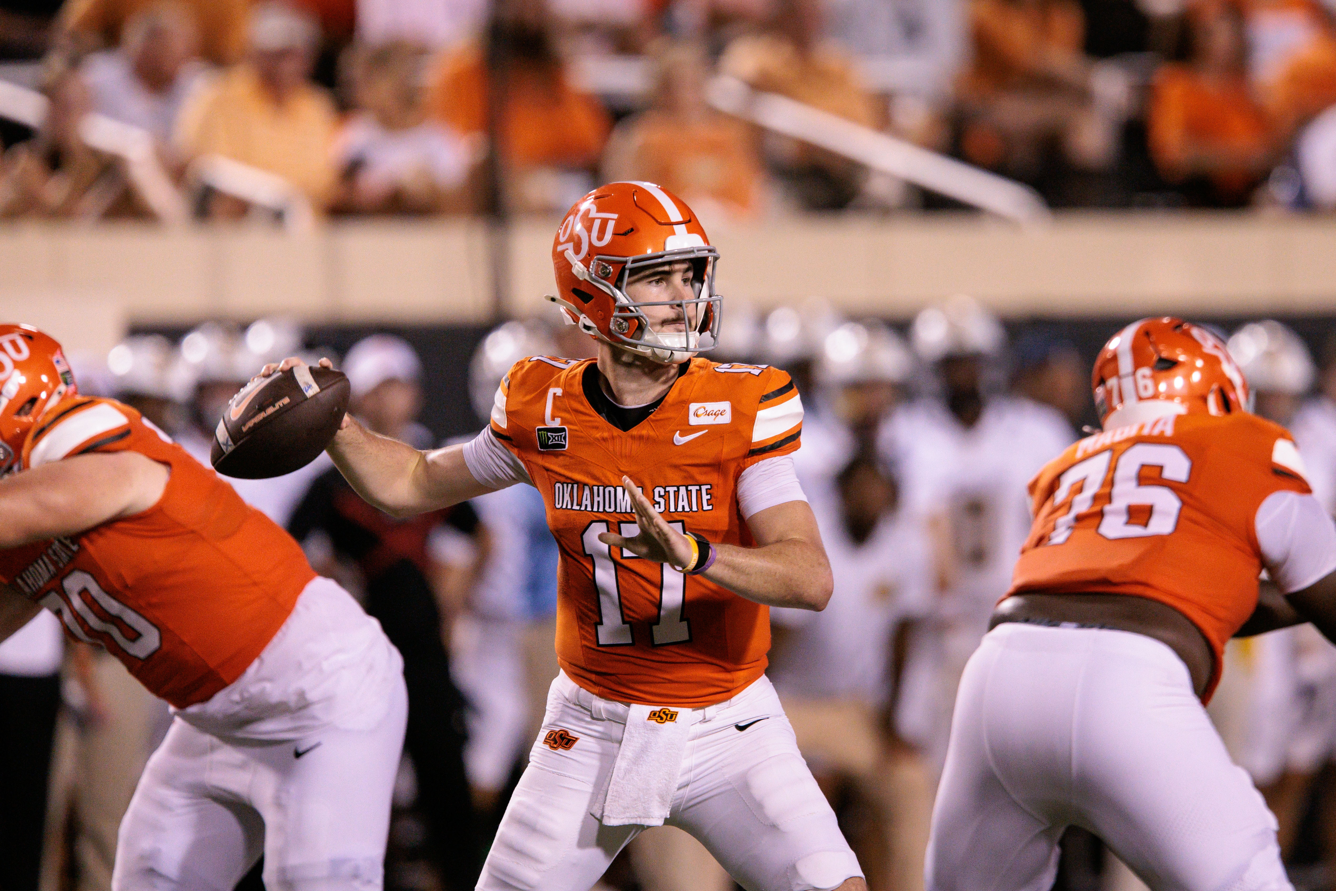 Oklahoma State Cowboys quarterback Drew Mestemaker looks to pass as we make our best Oklahoma State vs. West Virginia prediction