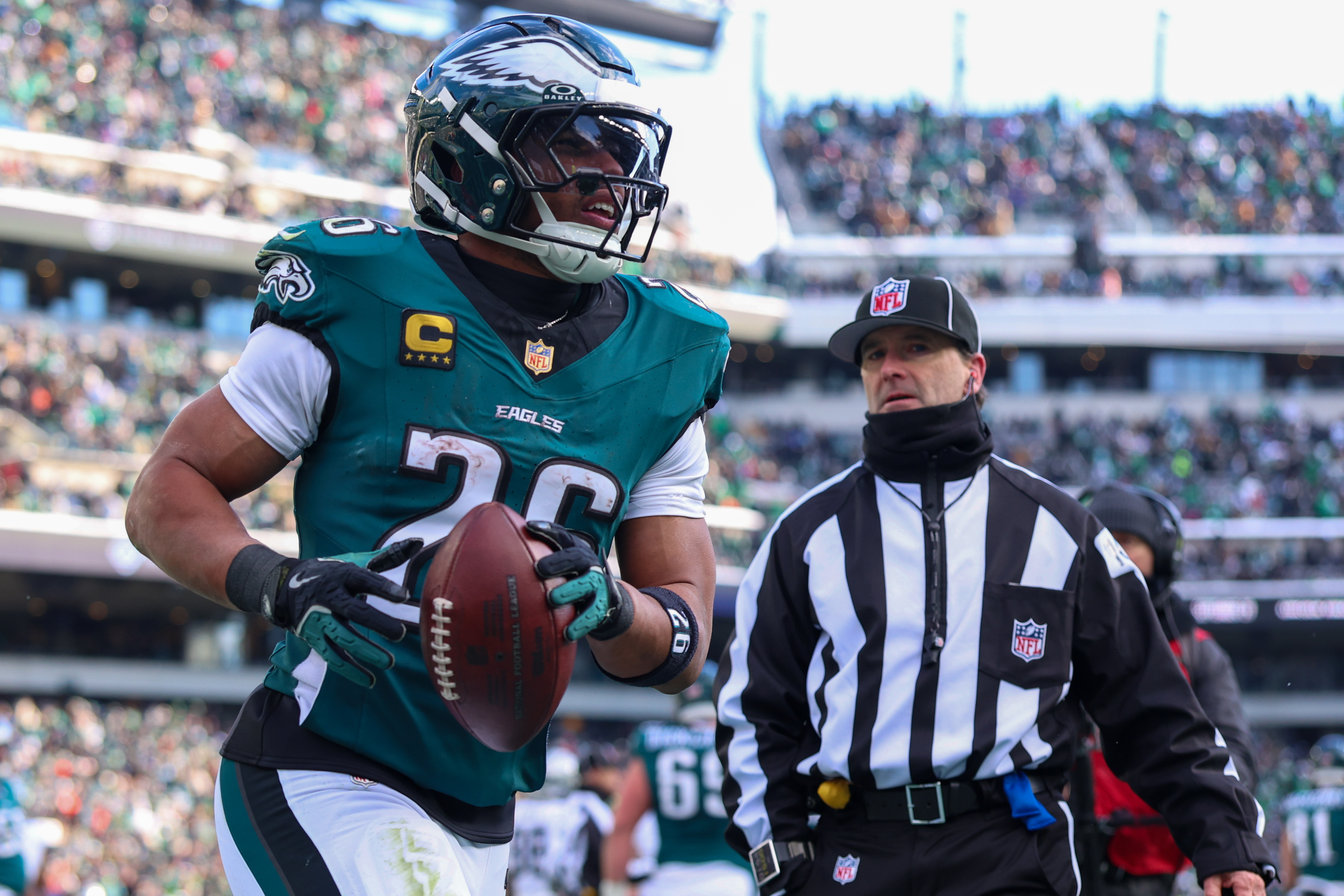 Philadelphia Eagles running back Saquon Barkley (26) reacts after scoring a touchdown as he is featured in our NFL 2+ touchdown scorer predictions.