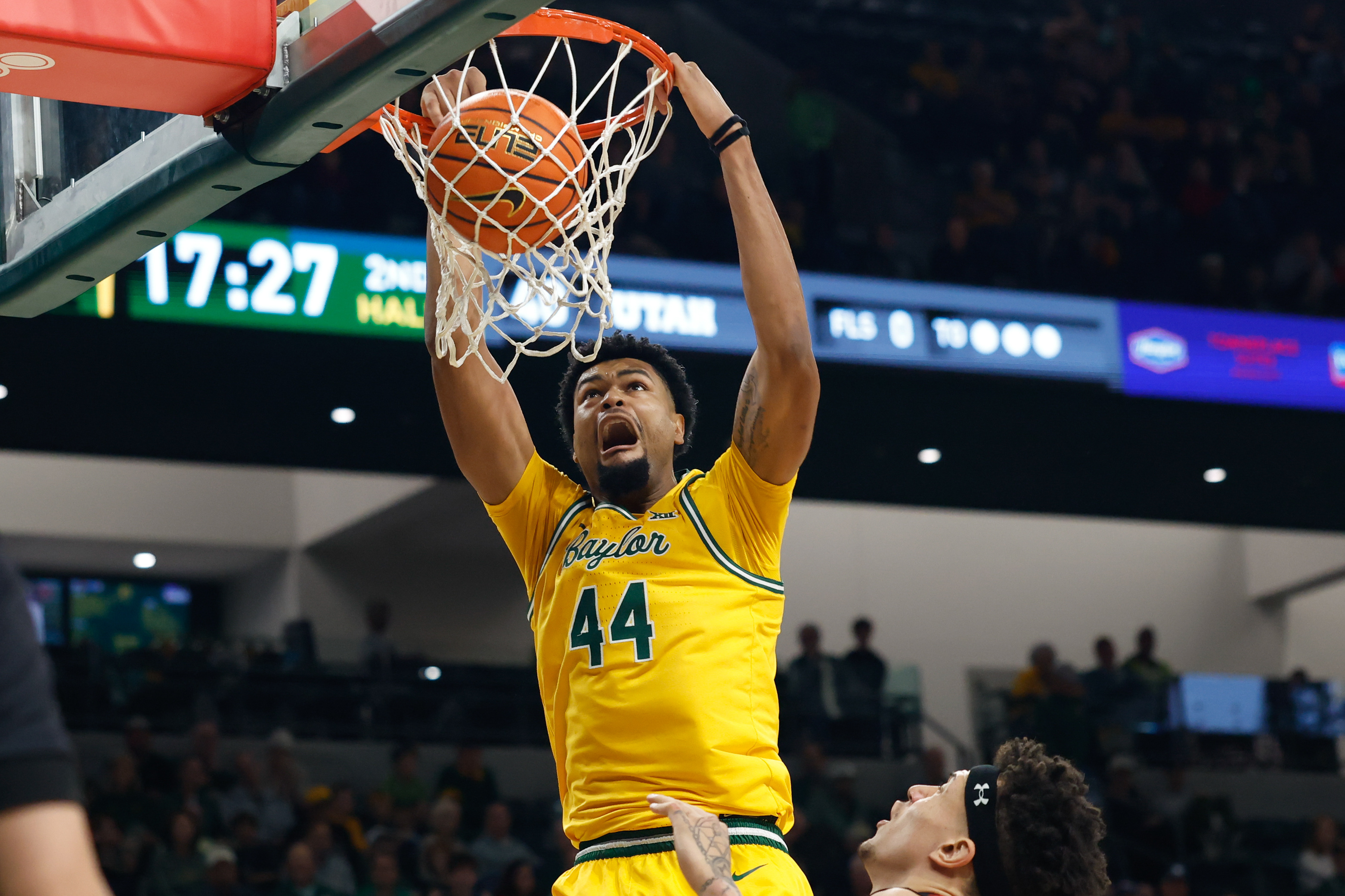 Baylor Bears center Caden Powell dunks the ball as we make our best Baylor vs. Minnesota prediction.