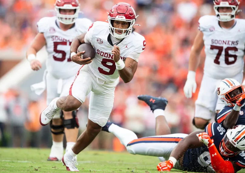 Oklahoma quarterback Michael Hawkins Jr. runs the ball against Auburn. We're backing Hawkins in our Texas vs. Oklahoma player prop bet.