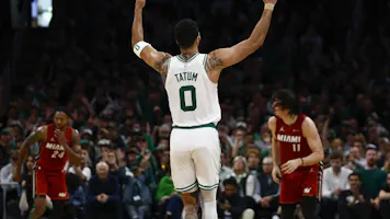 Jayson Tatum of the Boston Celtics raises his hands after making a 3-pointer against the Miami Heat during Game 1 of the NBA playoffs. We're backing Tatum in our Cavaliers vs. Celtics Player Props. 
