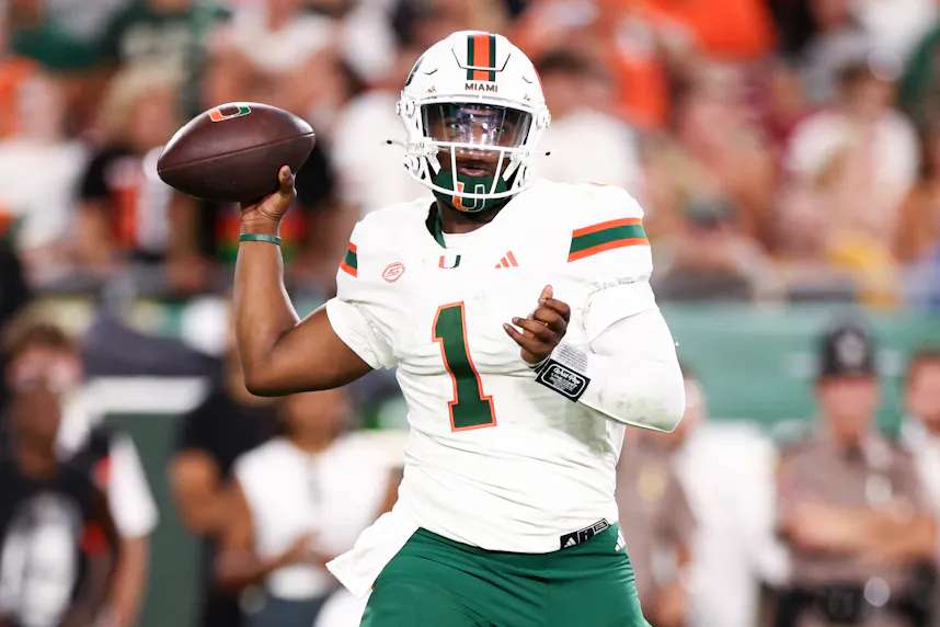 Miami Hurricanes quarterback Cam Ward drops back to pass against the South Florida Bulls as we look at our Miami vs. California Prediction.