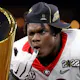 Jordan Davis of the Georgia Bulldogs celebrates with the National Championship trophy after the Georgia Bulldogs defeated the Alabama Crimson Tide 33-18 in the 2022 CFP National Championship Game at Lucas Oil Stadium on January 10, 2022.