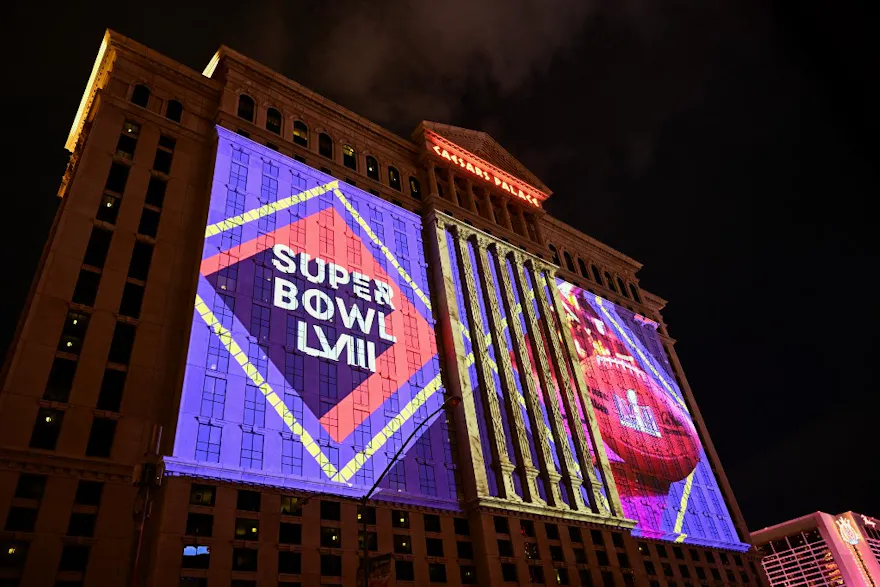 NFL Super Bowl LVIII football logos are projected on the side of the Caesars Palace Las Vegas Hotel and Casino ahead of Super Bowl LVIII as we look at the Caesars fourth quarter earnings report.