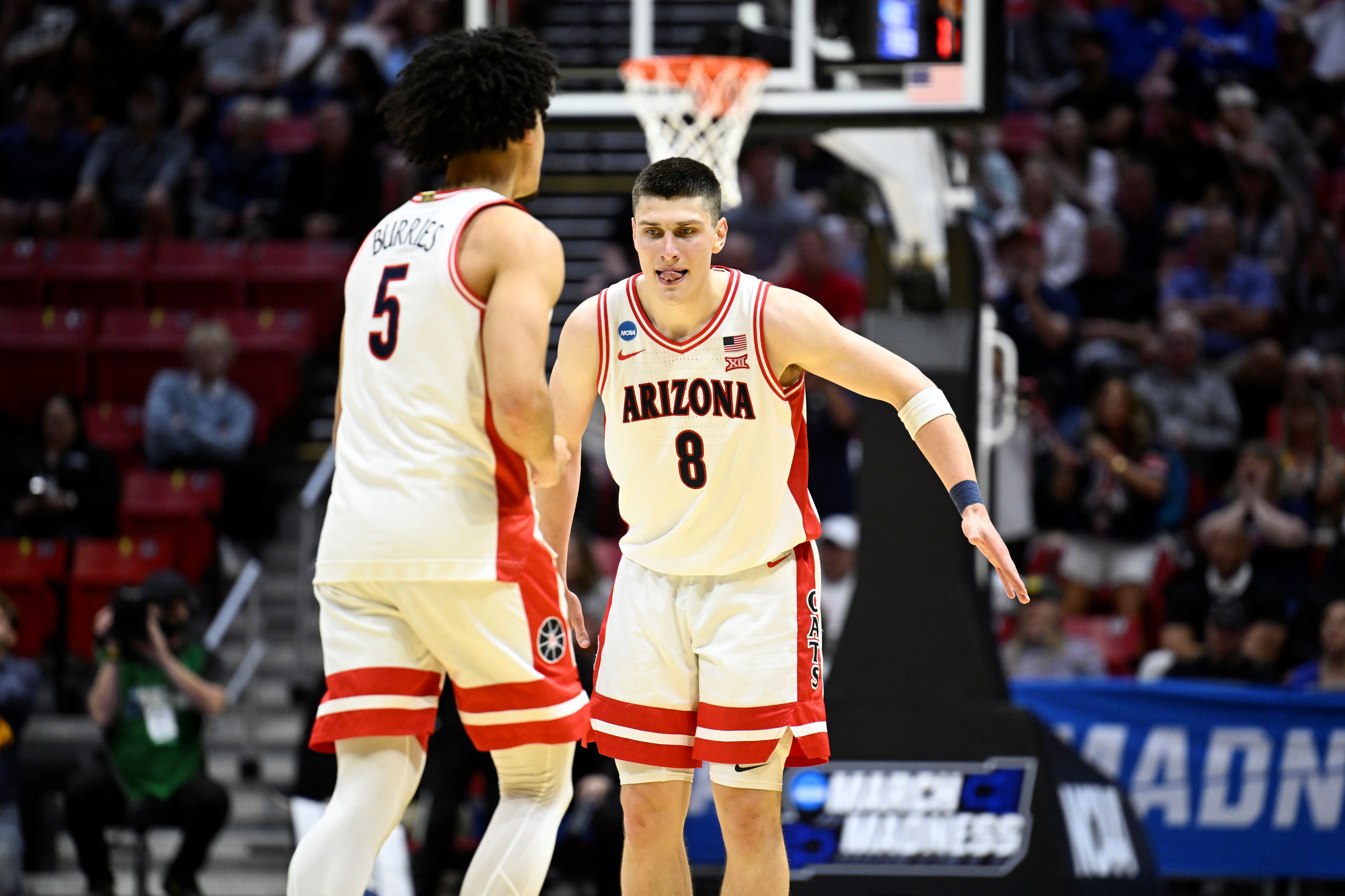 Ivan Kharchenkov (8) and Brayden Burries (5), featured in our March Madness player props today for the Elite Eight, react during a second-round win.