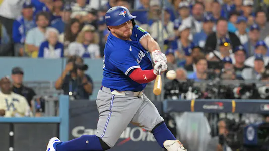 Toronto Blue Jays catcher Alejandro Kirk (30) hits a home run as we offer our Blue Jays vs. Dodgers prediction