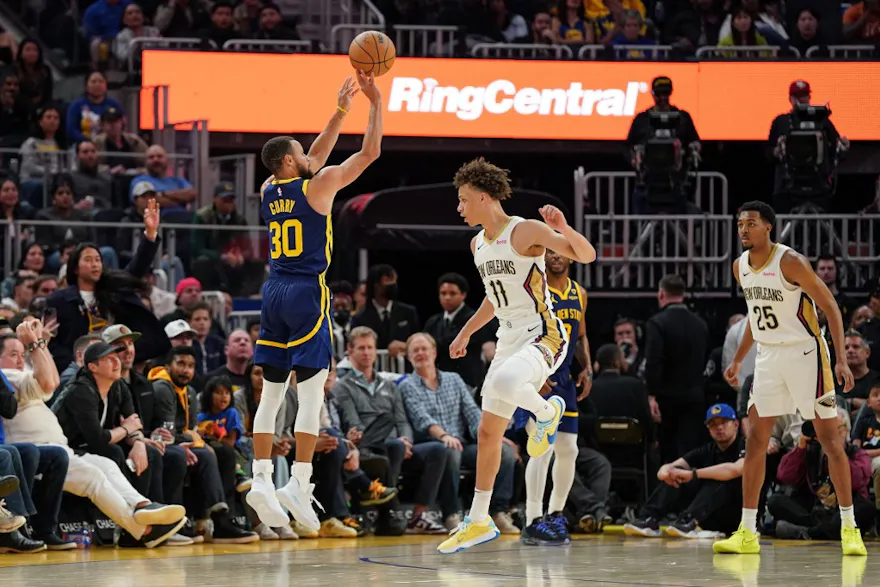 Stephen Curry of the Golden State Warriors attempts a 3-point jump shot in the fourth quarter against Dyson Daniels of the New Orleans Pelicans. We're backing Curry in our Warriors vs. Kings player props.