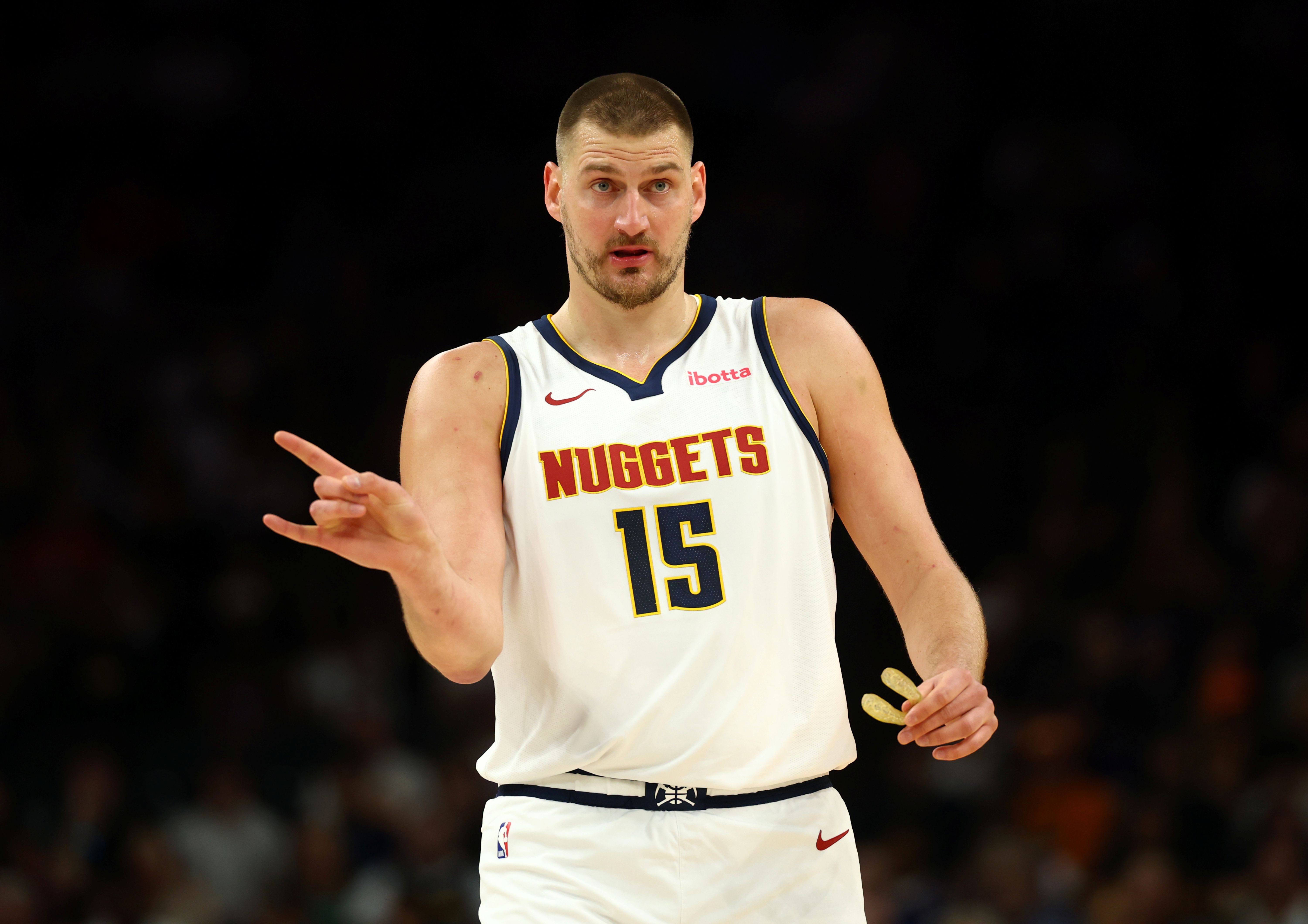 Denver Nuggets center Nikola Jokic reacts, and he's key as we look at our Warriors vs. Nuggets player props.