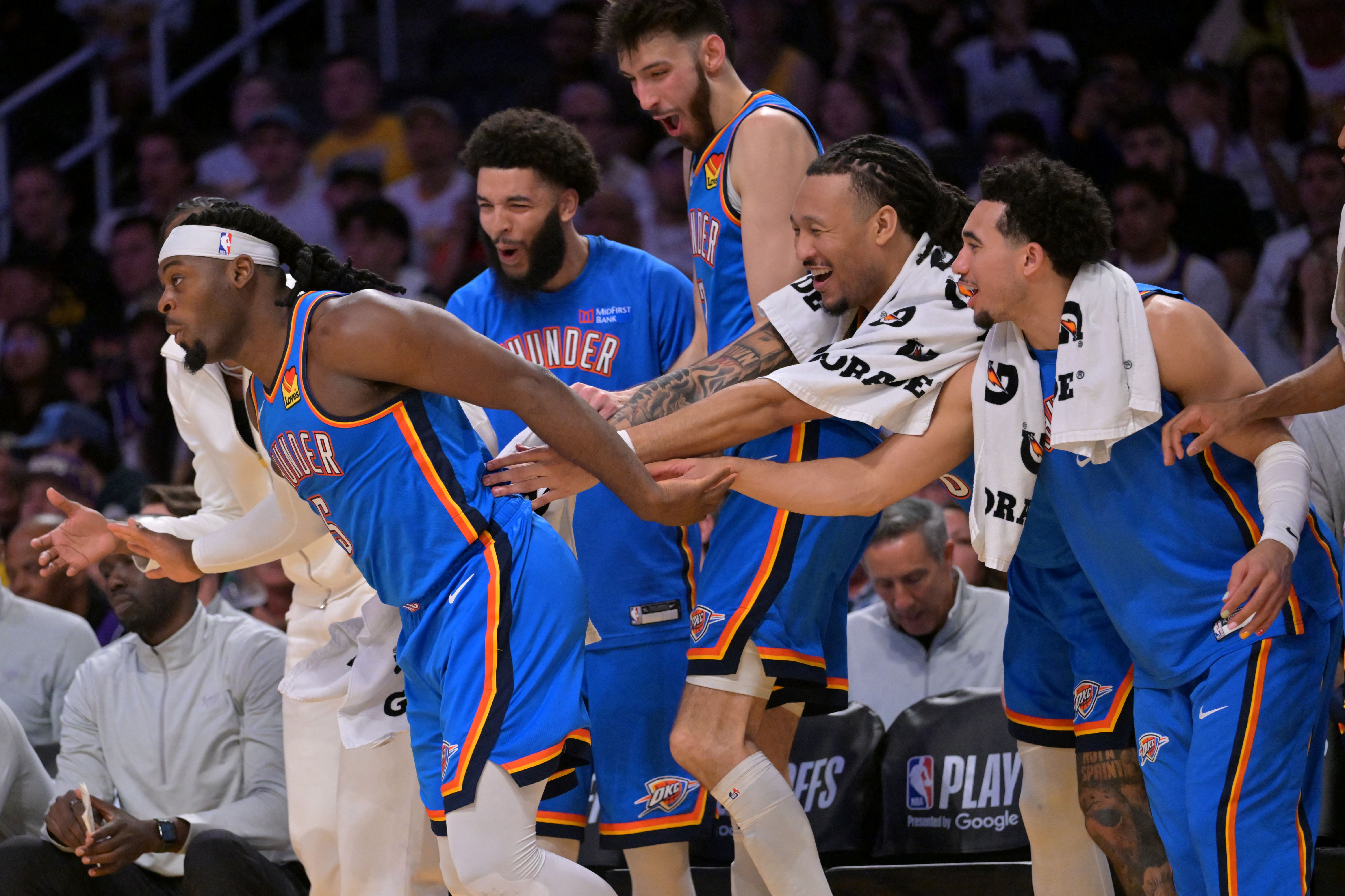 Oklahoma City Thunder guard Luguentz Dort (5) is congratulated by the bench as we break down the 2026 NBA championship odds.