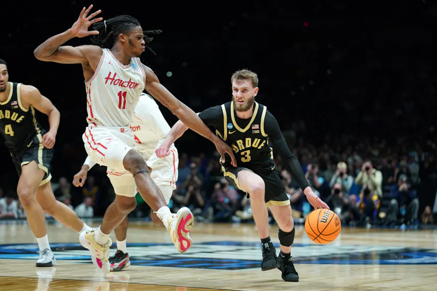 Purdue guard Braden Smith (3) dribbles the ball past Houston forward Joseph Tugler (11); both have their teams among the March Madness odds favorites.